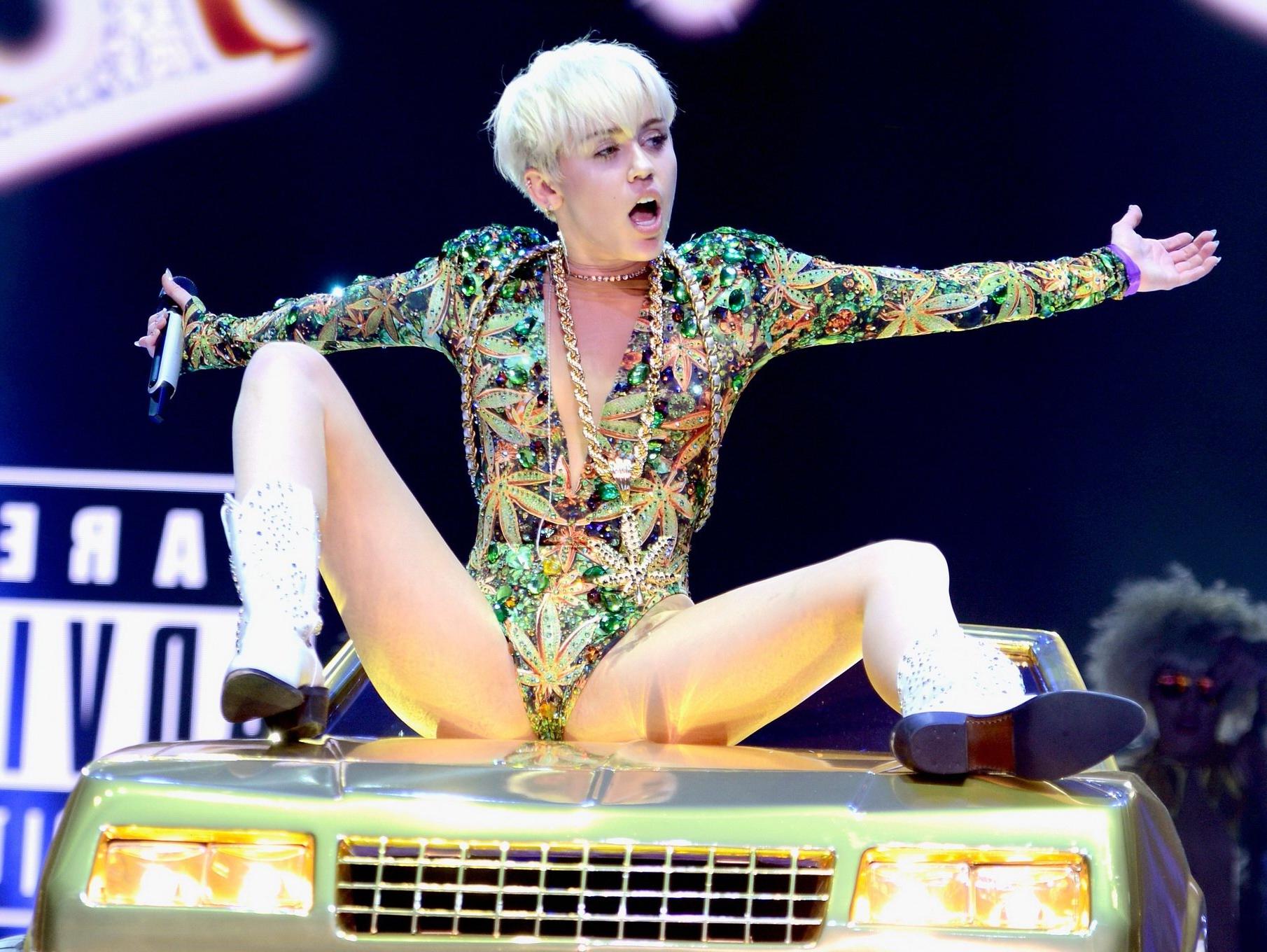16P Miley Cyrus naughty performance in marijuana leaf print bodysuit during the Bang