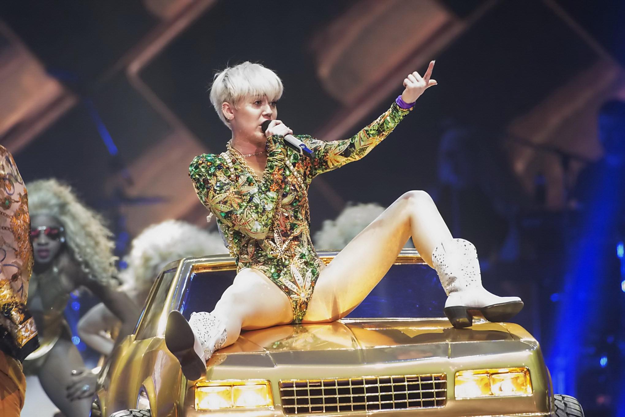 16P Miley Cyrus naughty performance in marijuana leaf print bodysuit during the Bang