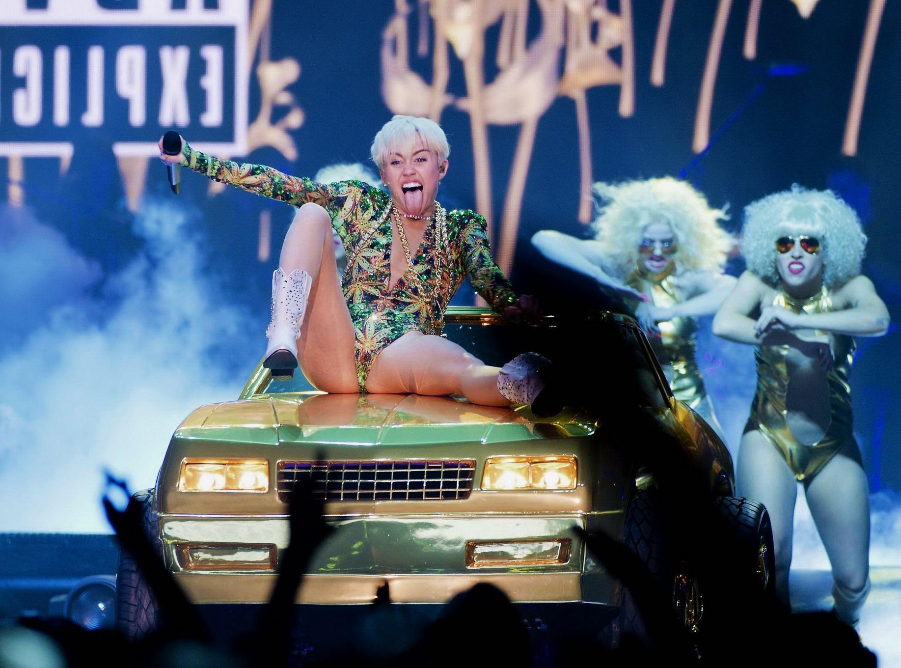 16P Miley Cyrus naughty performance in marijuana leaf print bodysuit during the Bang