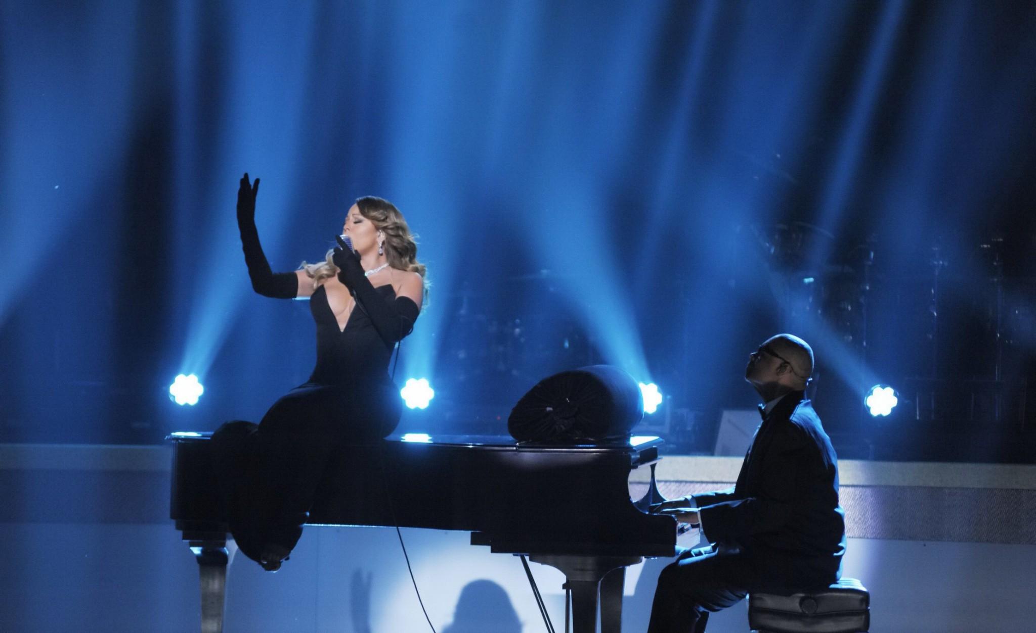16P Mariah Carey braless showing huge cleavage in a tight black dress while performs