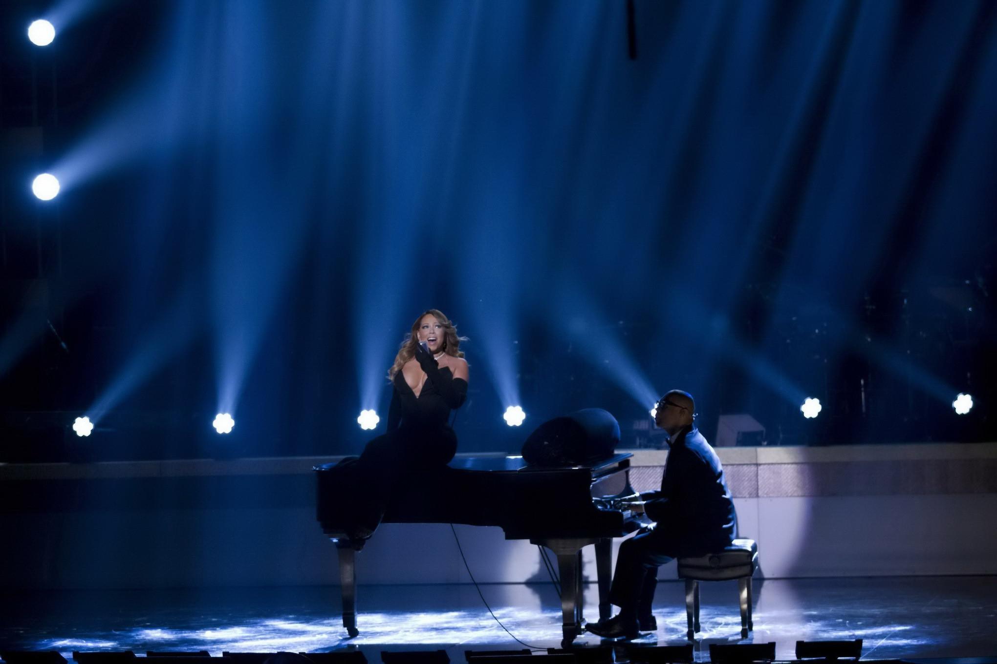 16P Mariah Carey braless showing huge cleavage in a tight black dress while performs