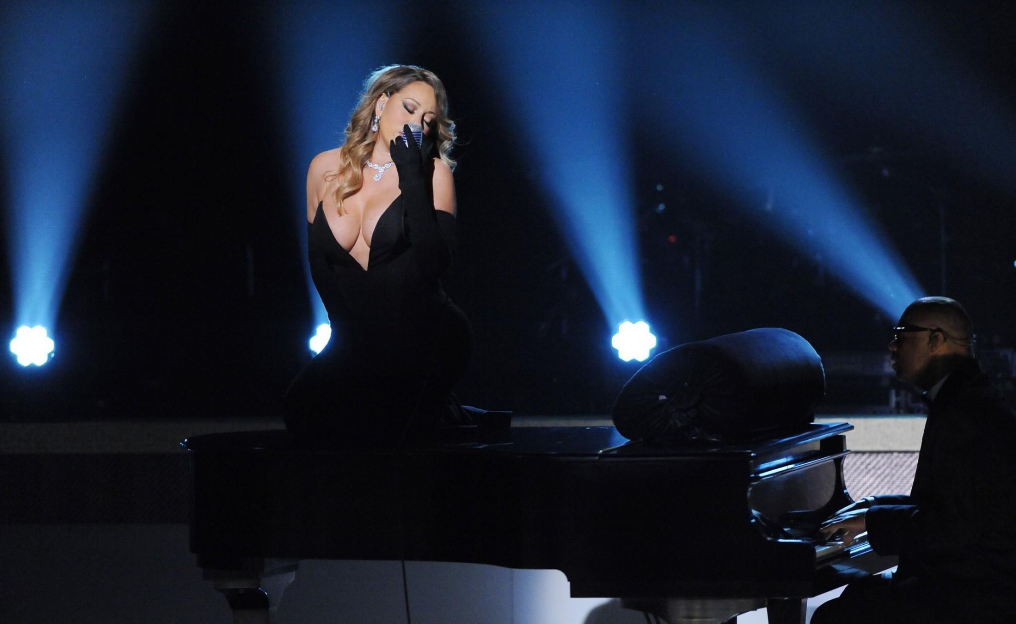 16P Mariah Carey braless showing huge cleavage in a tight black dress while performs