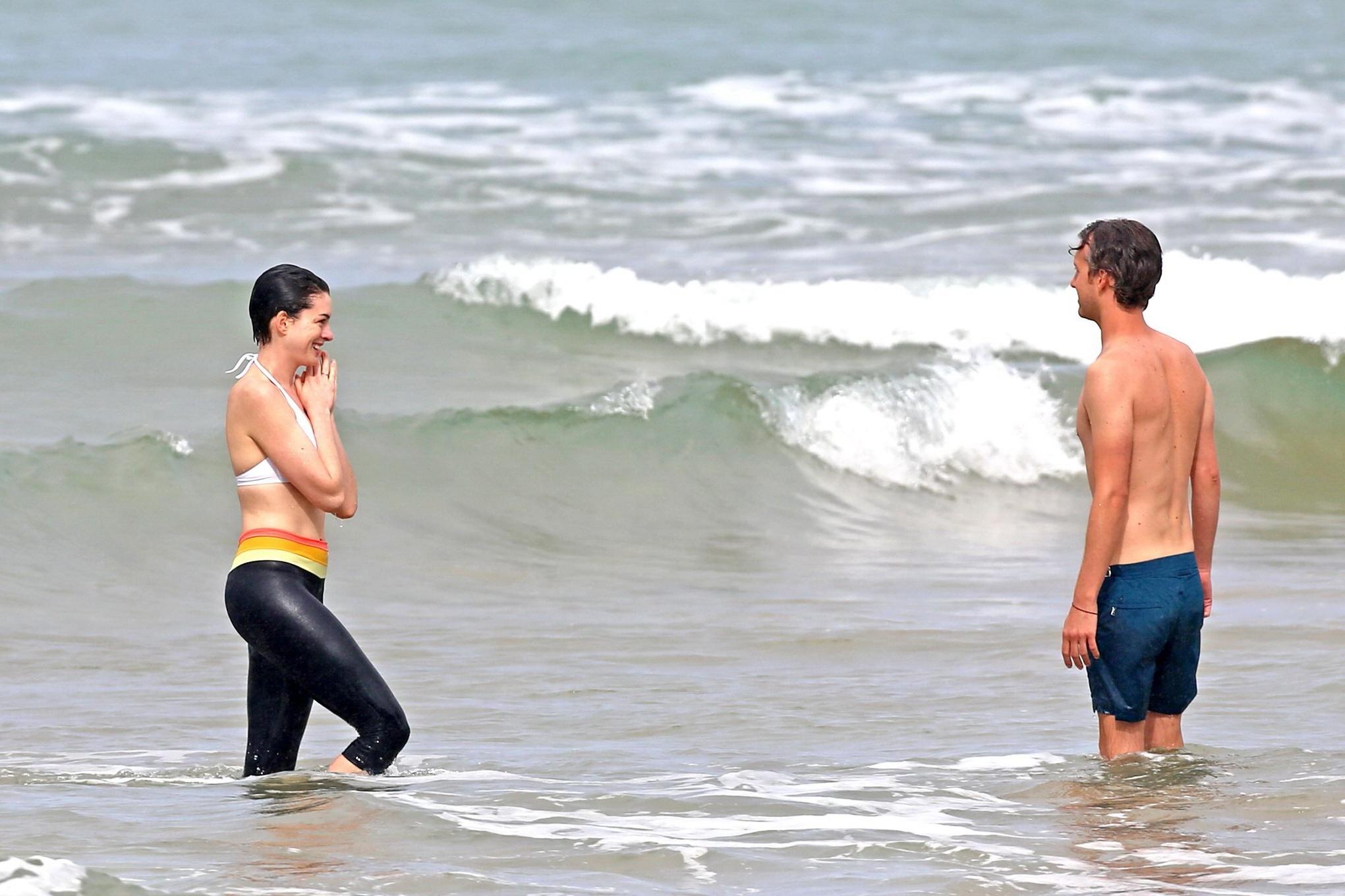 16P Anne Hathaway showing pokies in wet bikini tops on a Hawaiian beach