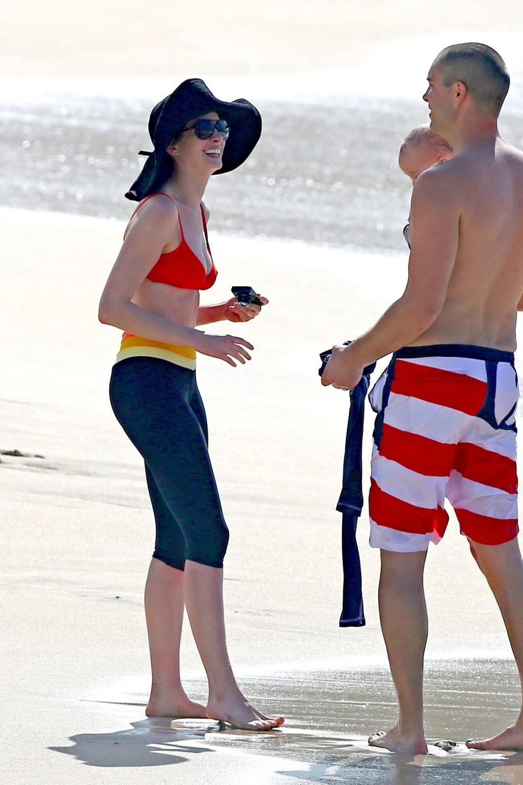 16P Anne Hathaway showing pokies in wet bikini tops on a Hawaiian beach
