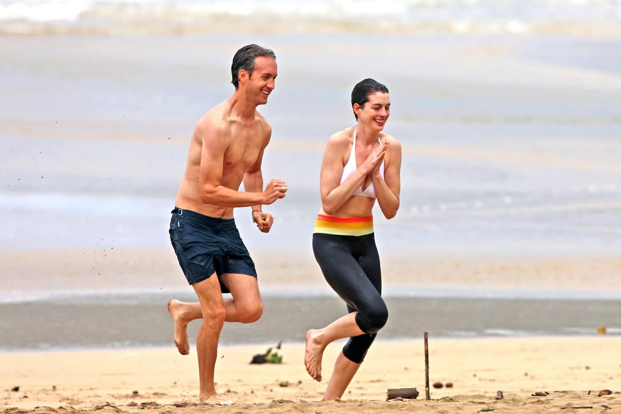 16P Anne Hathaway showing pokies in wet bikini tops on a Hawaiian beach