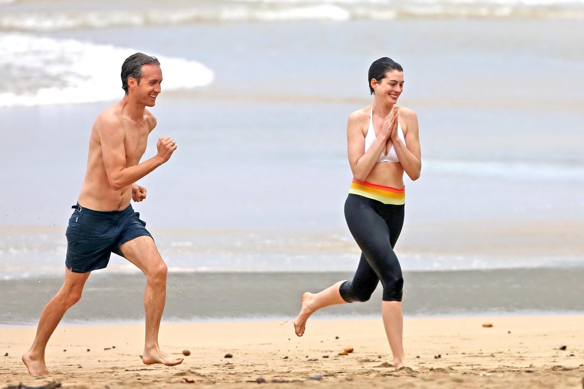 16P Anne Hathaway showing pokies in wet bikini tops on a Hawaiian beach