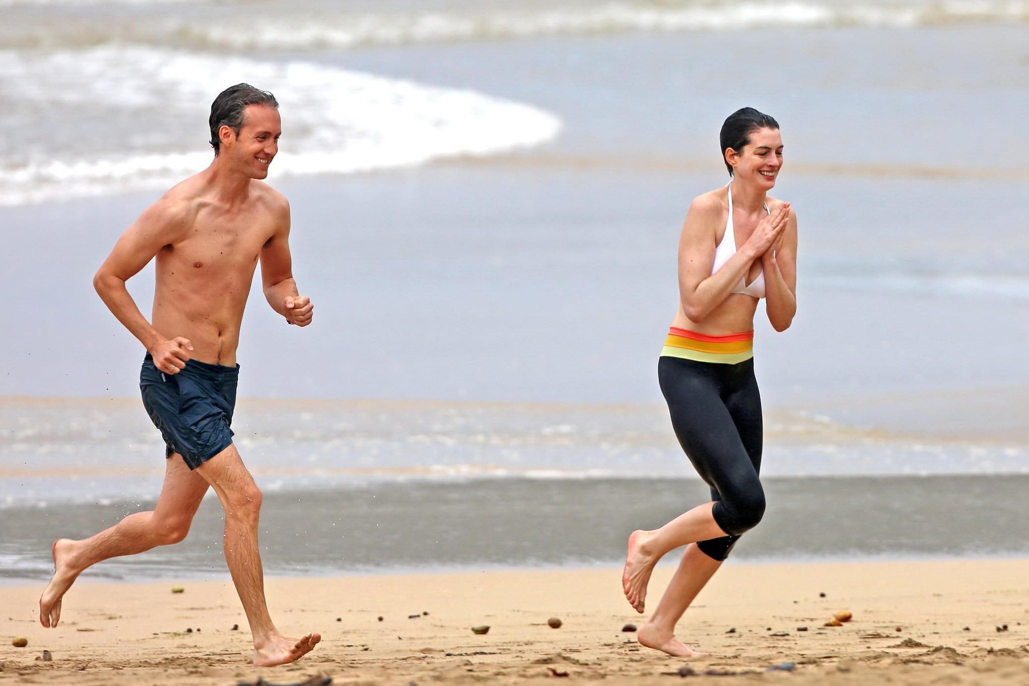 16P Anne Hathaway showing pokies in wet bikini tops on a Hawaiian beach