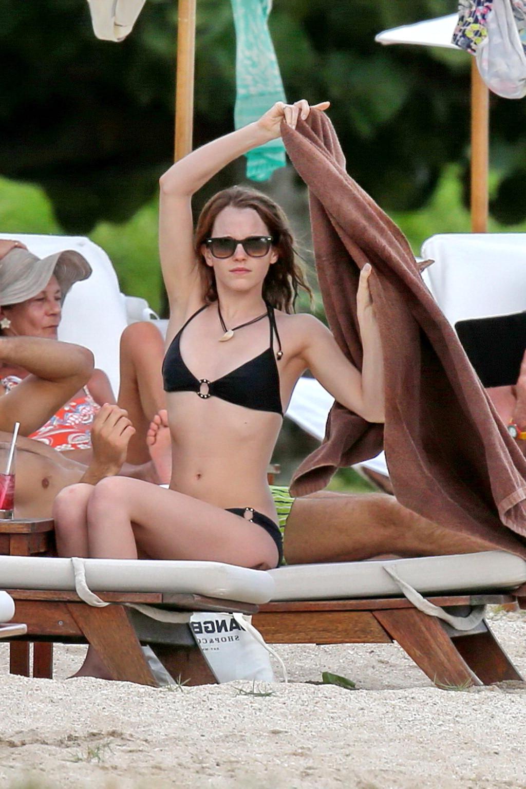 16P Emma Watson in black bikini petting with her boyfriend on a Carribean beach