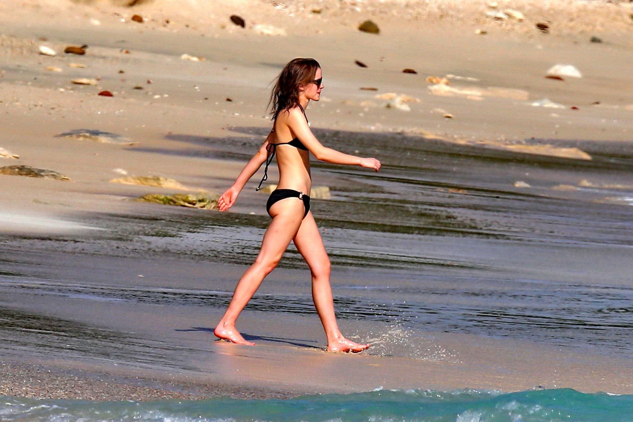 16P Emma Watson in black bikini petting with her boyfriend on a Carribean beach