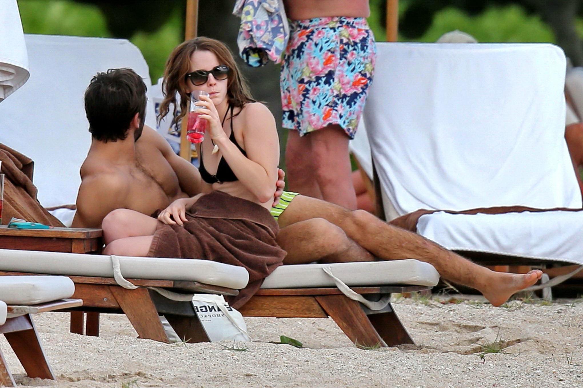 16P Emma Watson in black bikini petting with her boyfriend on a Carribean beach