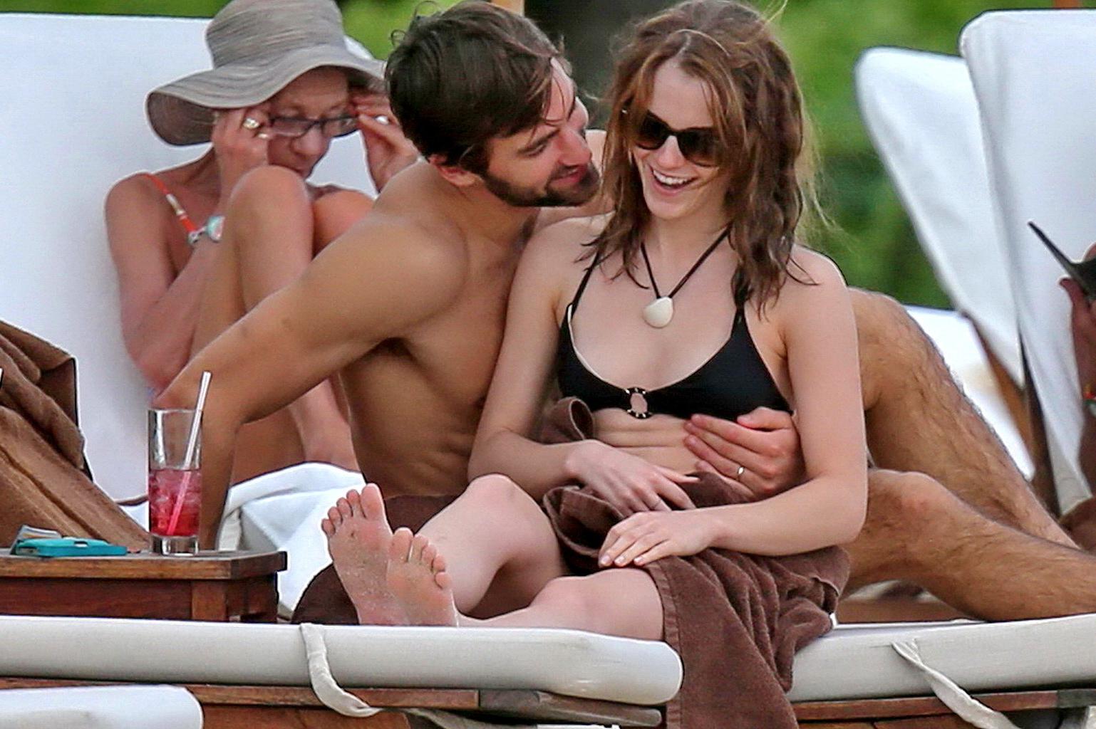 16P Emma Watson in black bikini petting with her boyfriend on a Carribean beach