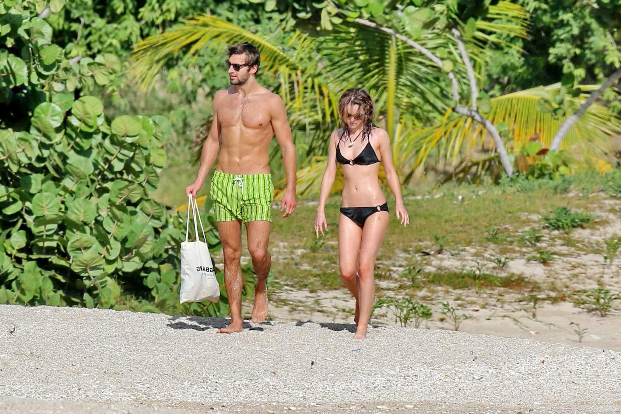 16P Emma Watson in black bikini petting with her boyfriend on a Carribean beach
