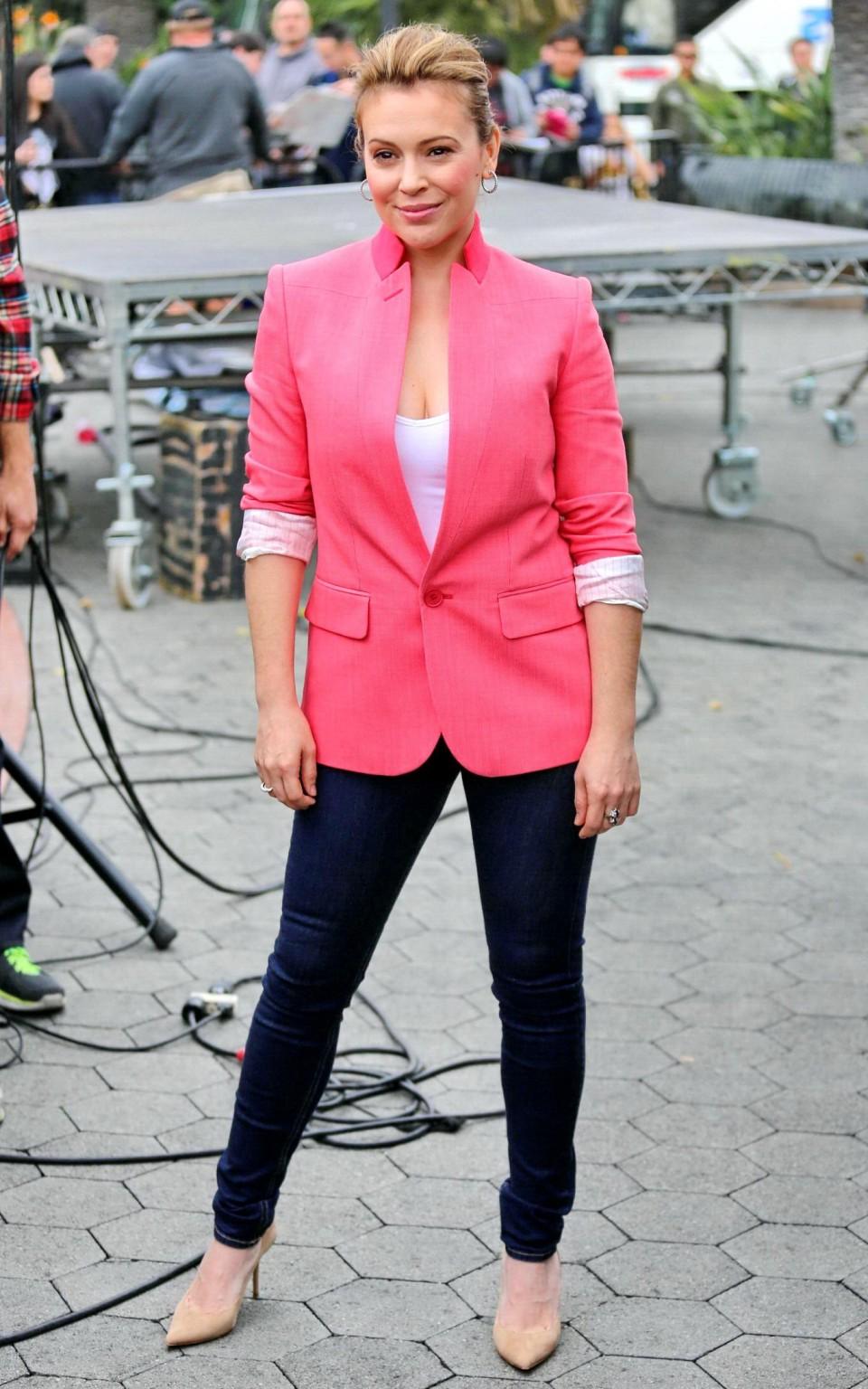 16P Alyssa Milano showing huge cleavage on the set of 'Extra' at The Grove in LA
