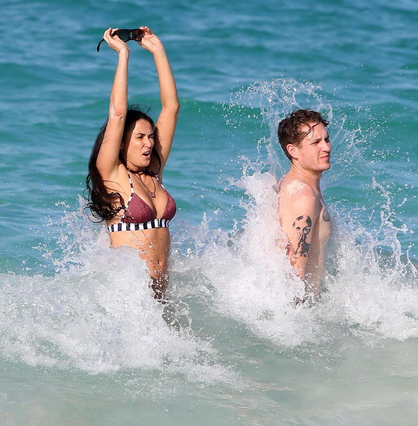 16P Demi Moore showing off her bikini body on a beach in Mexico