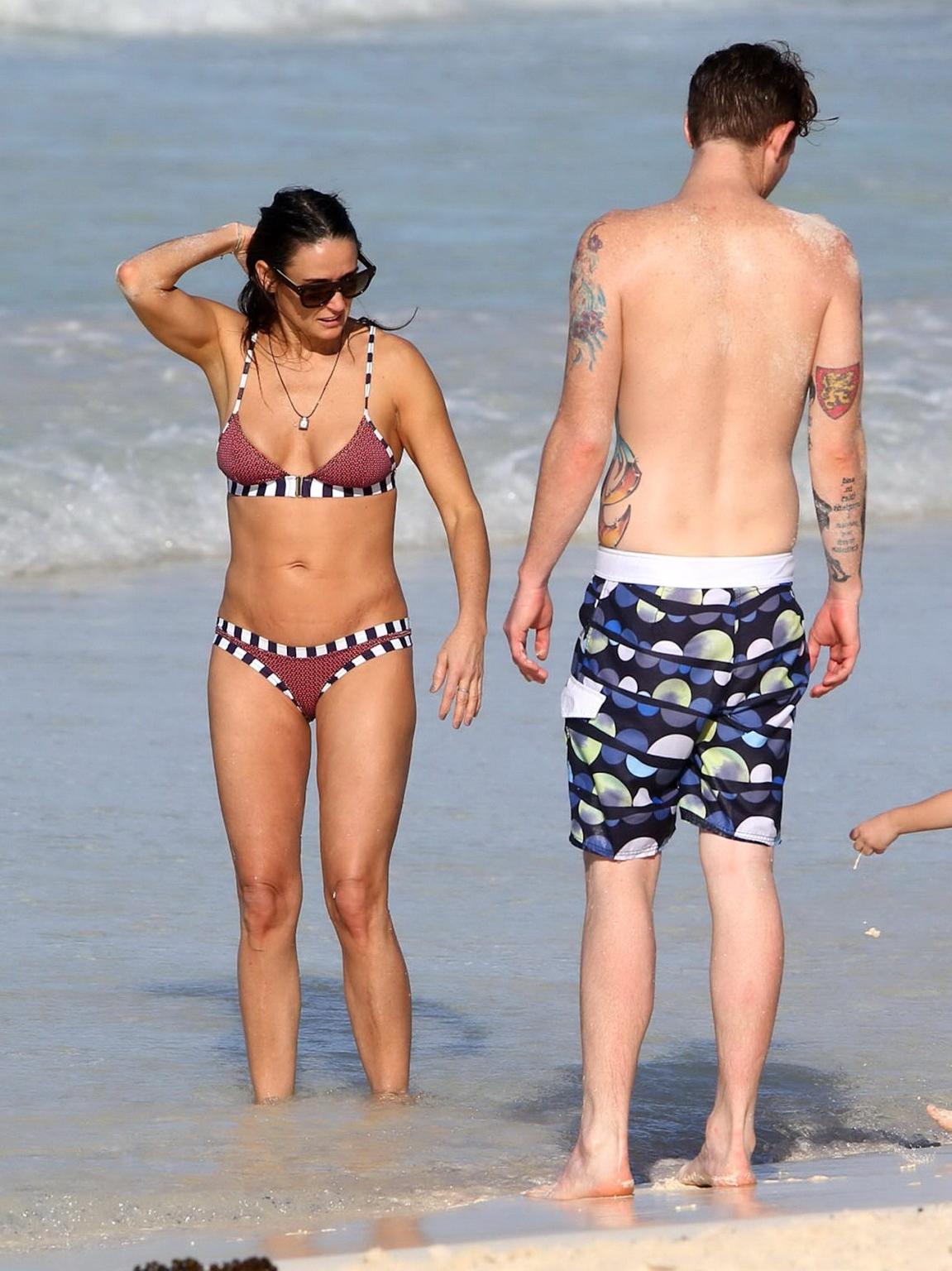 16P Demi Moore showing off her bikini body on a beach in Mexico