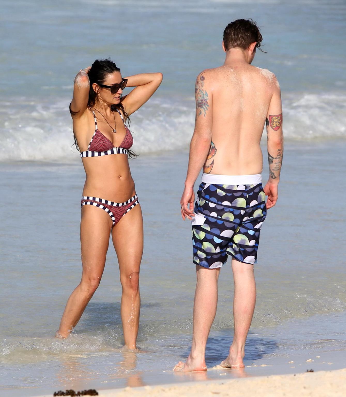 16P Demi Moore showing off her bikini body on a beach in Mexico