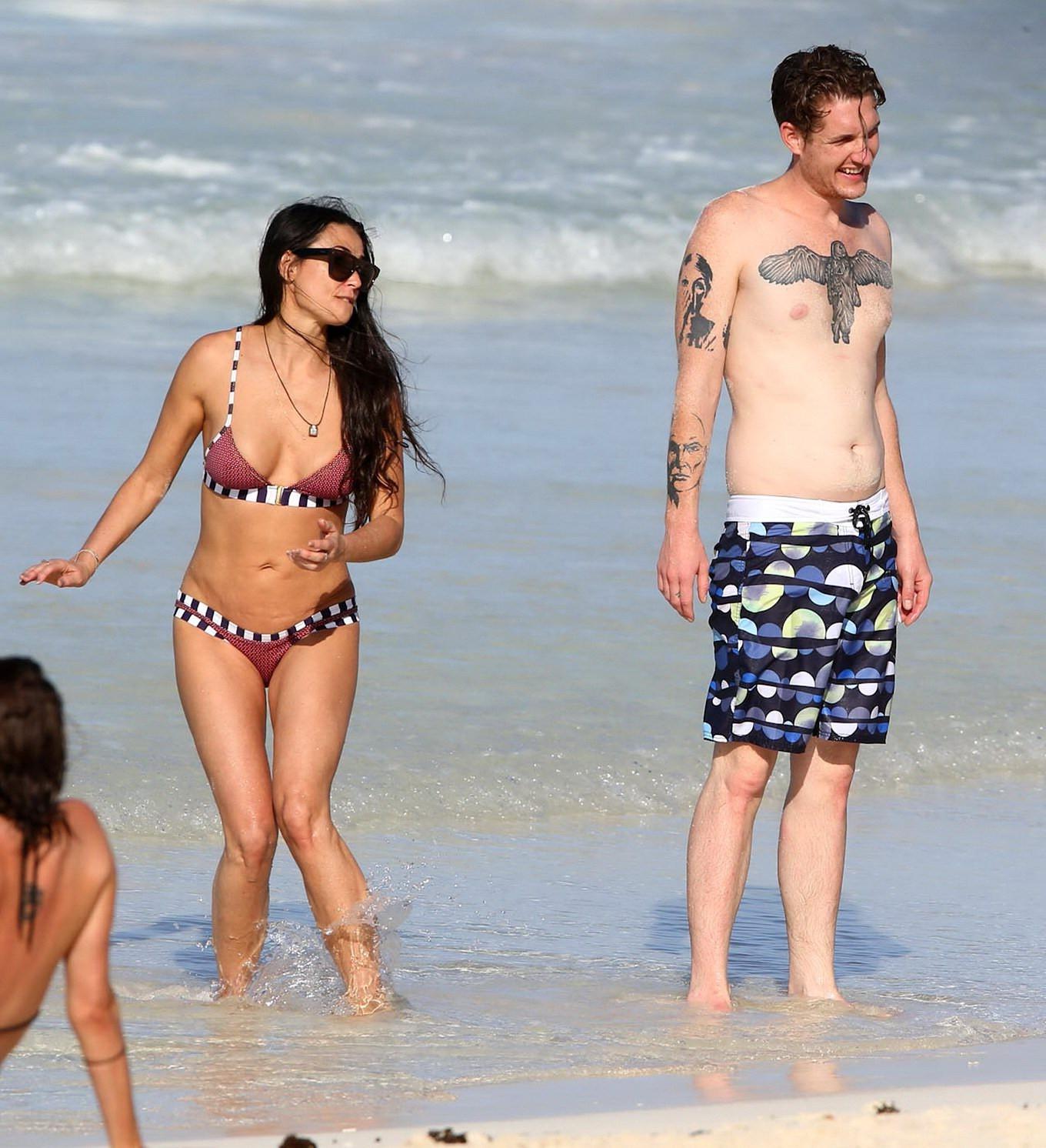 16P Demi Moore showing off her bikini body on a beach in Mexico