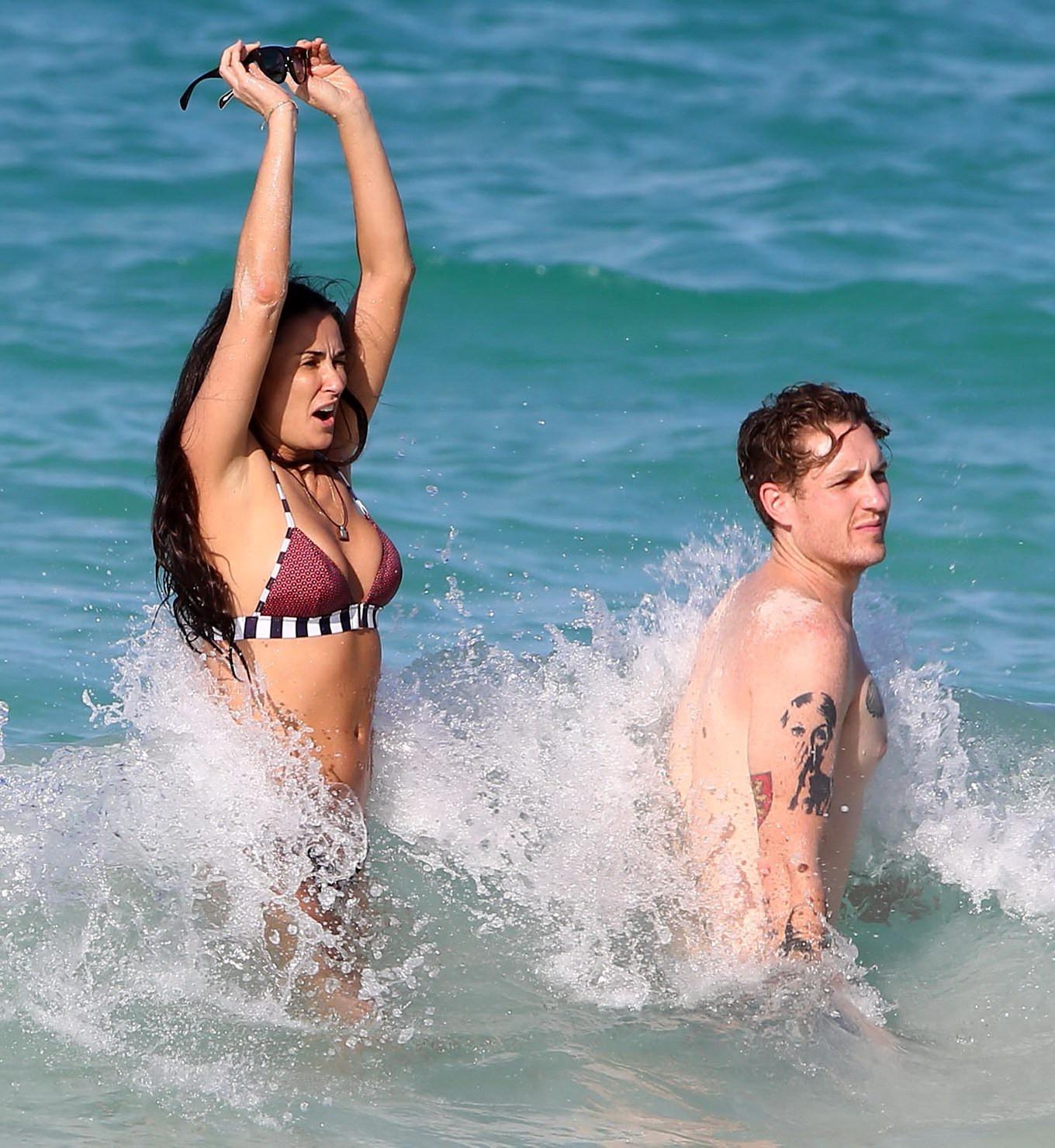 16P Demi Moore showing off her bikini body on a beach in Mexico