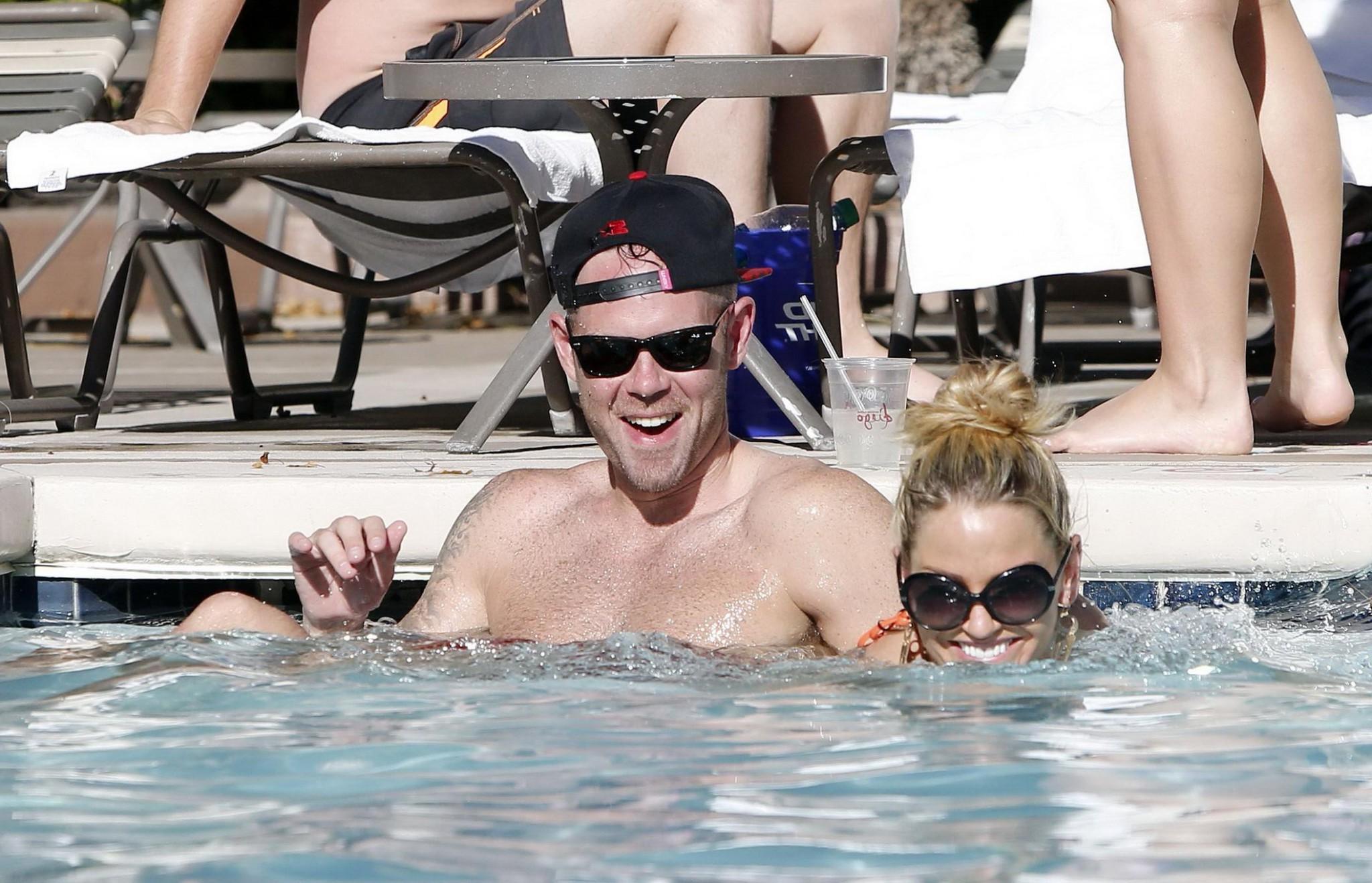 16P Sarah Harding wearing an orange bikini at the pool in Las Vegas