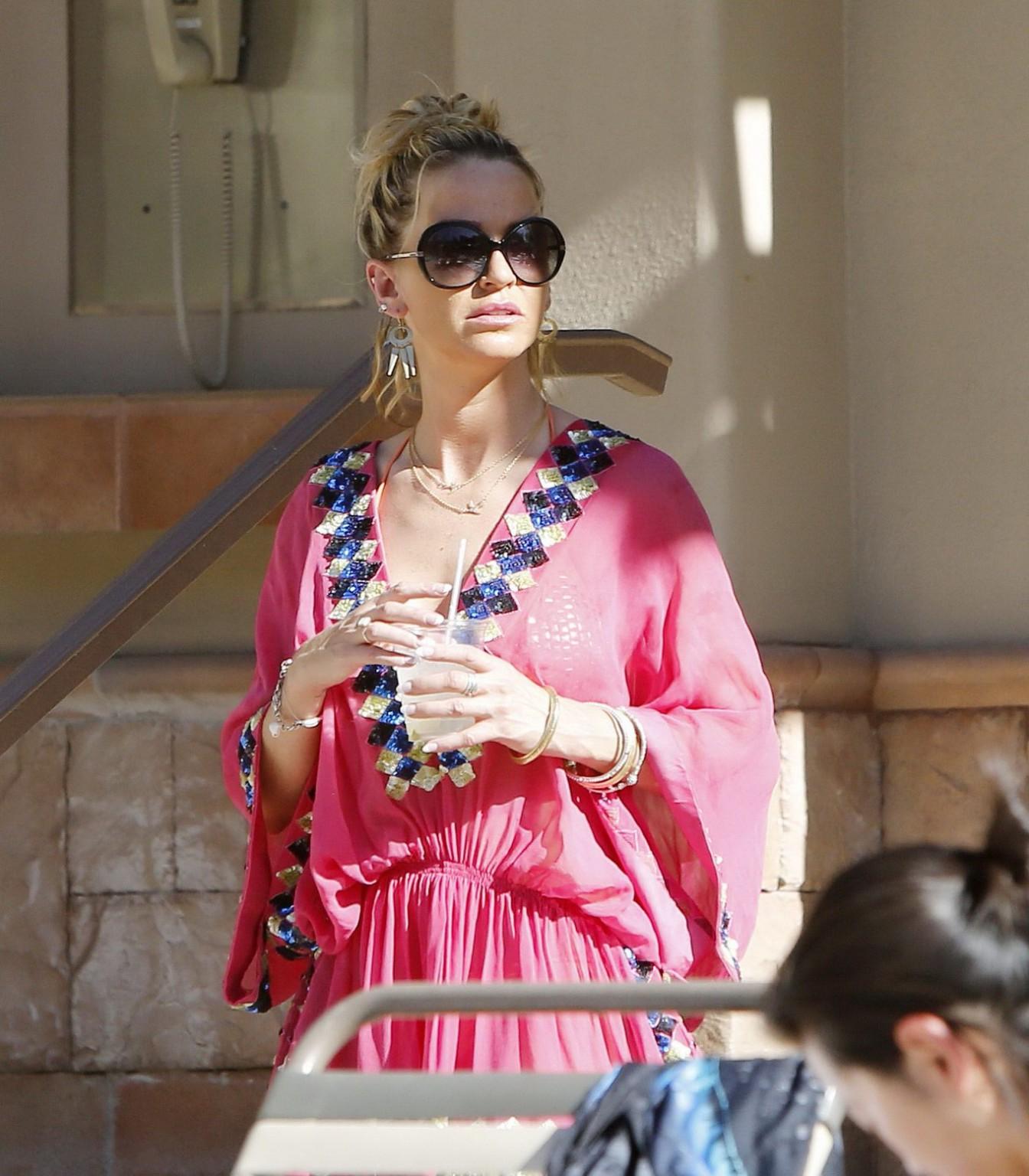 16P Sarah Harding wearing an orange bikini at the pool in Las Vegas
