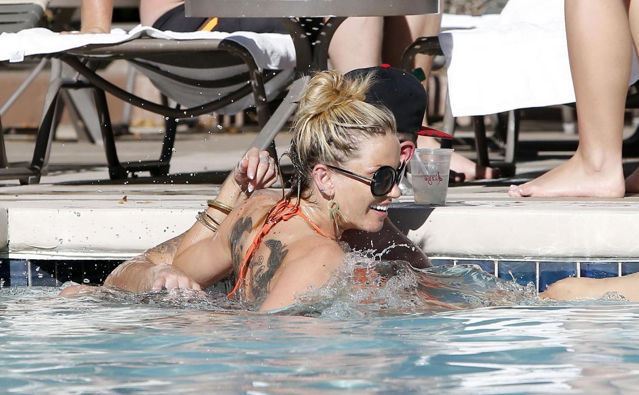 16P Sarah Harding wearing an orange bikini at the pool in Las Vegas