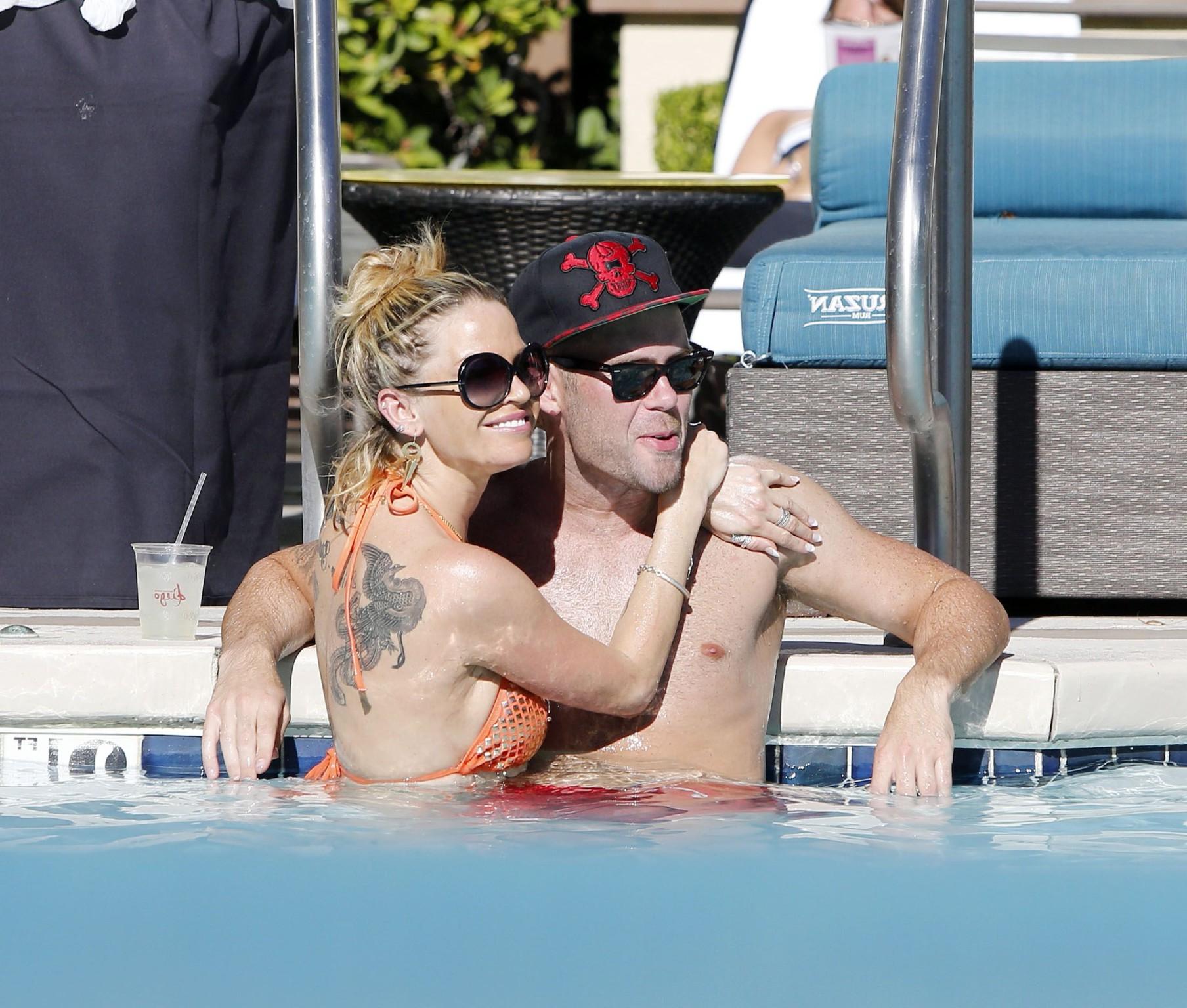 16P Sarah Harding wearing an orange bikini at the pool in Las Vegas