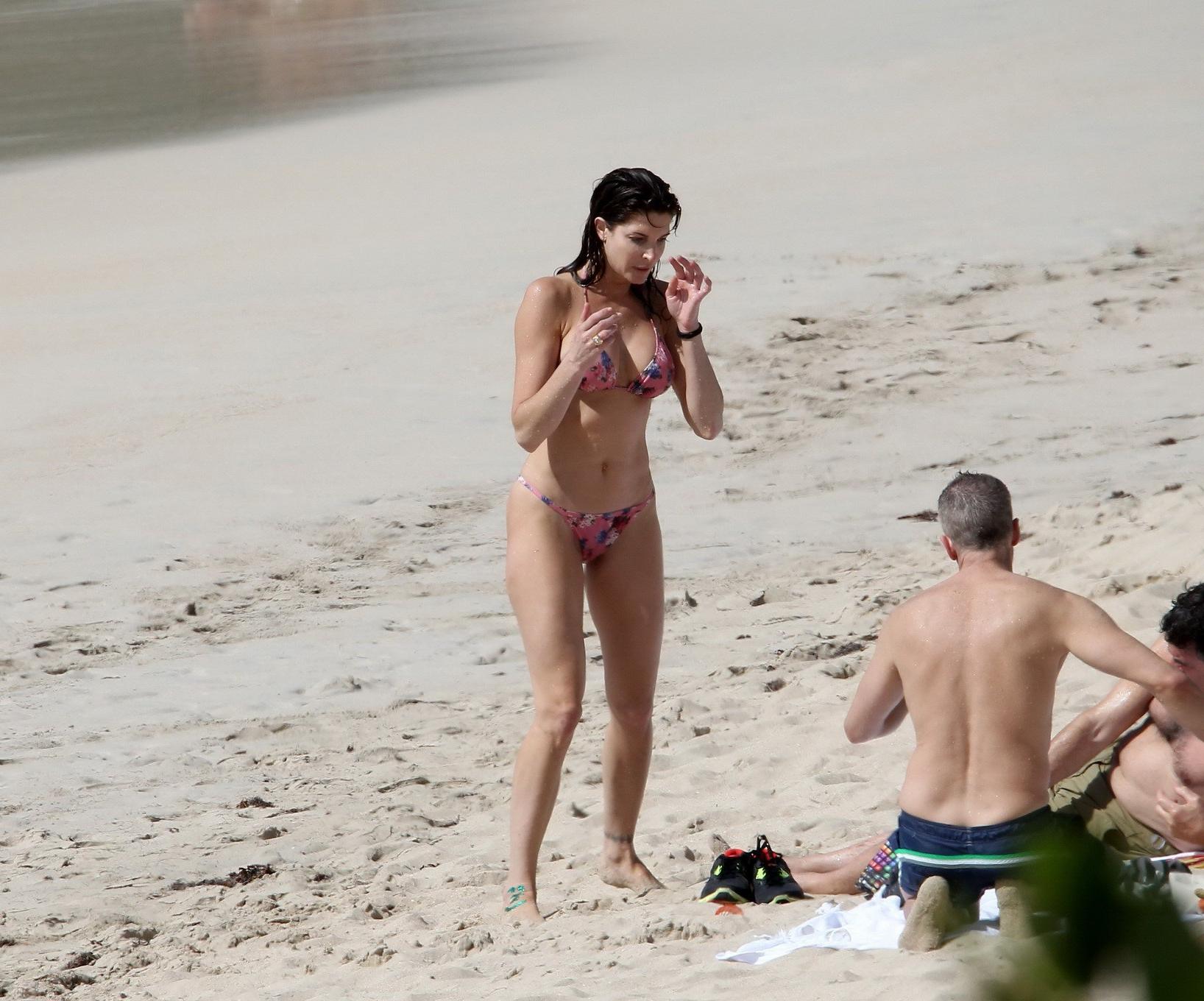 16P Stephanie Seymour wearing skimpy floral bikini at the beach in St.Barts