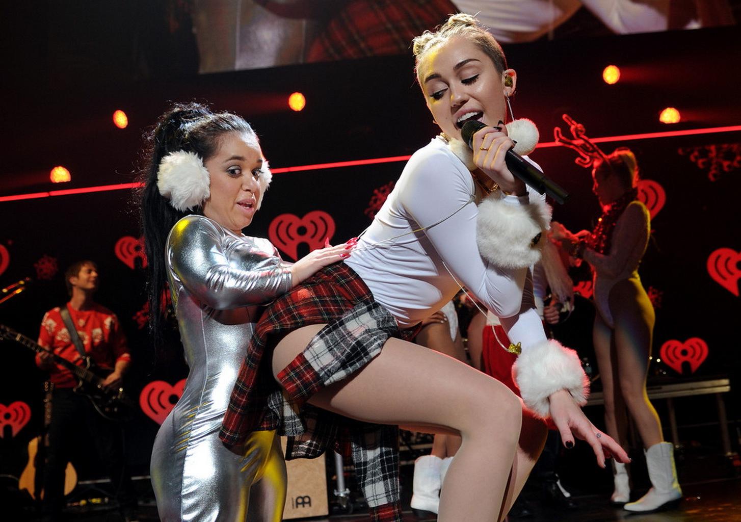 16P Miley Cyrus wearing white transparent bodysuit at Y100 Jingle Ball 2013 in Miami
