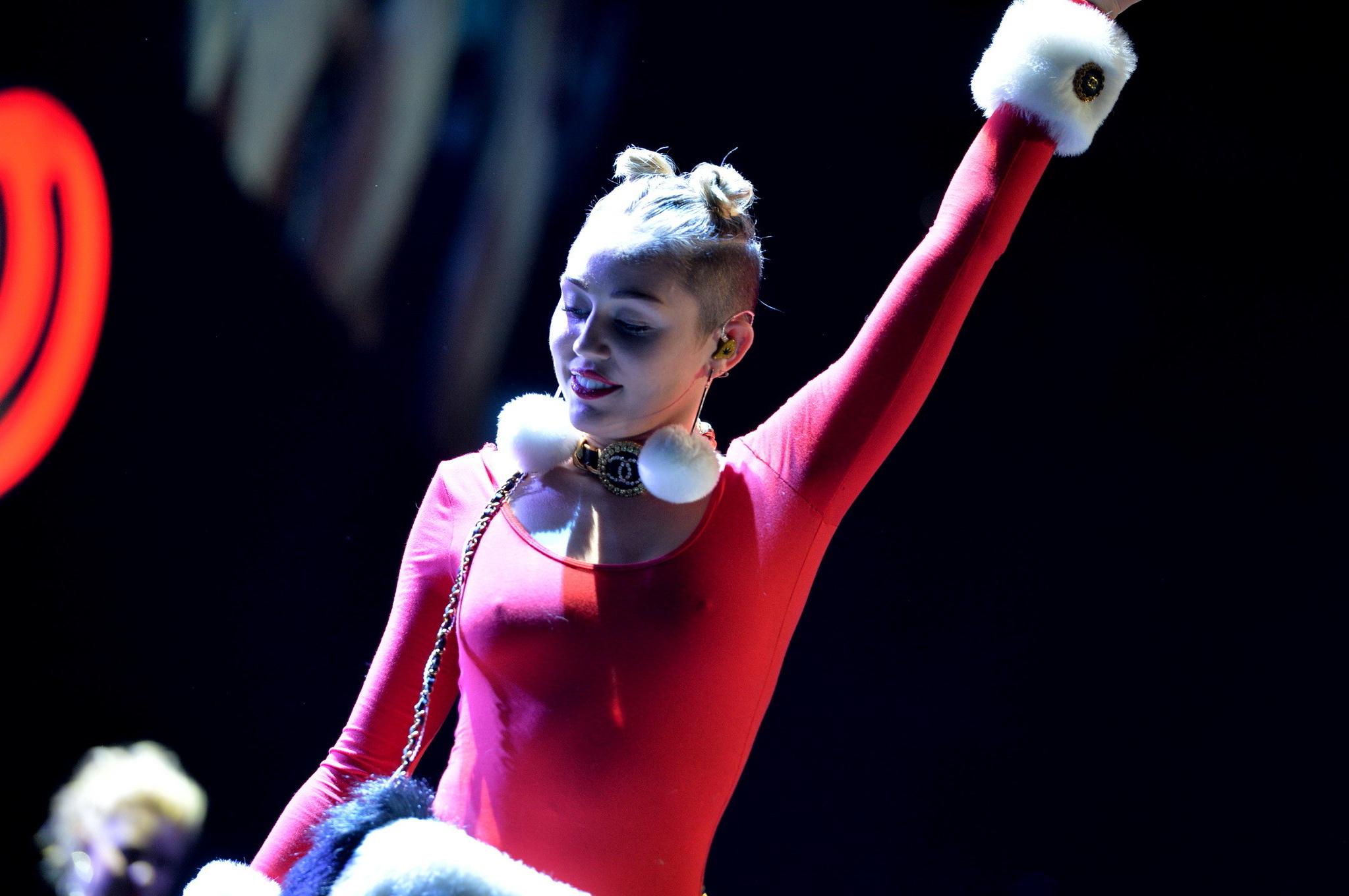 16P Miley Cyrus shows off pokies and ass wearing a red leotard on stage at 93.3 FLZ'