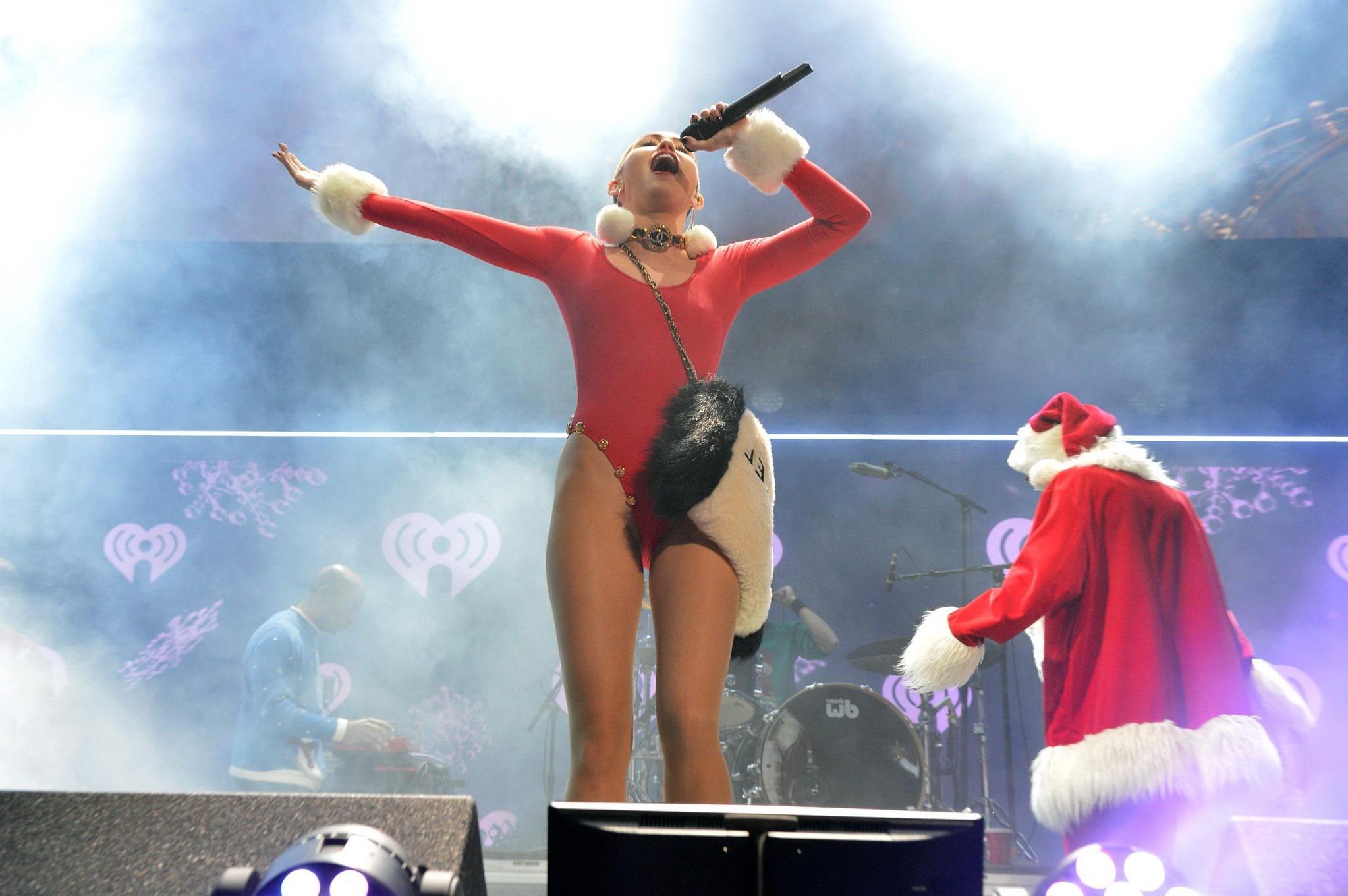 16P Miley Cyrus shows off pokies and ass wearing a red leotard on stage at 93.3 FLZ'
