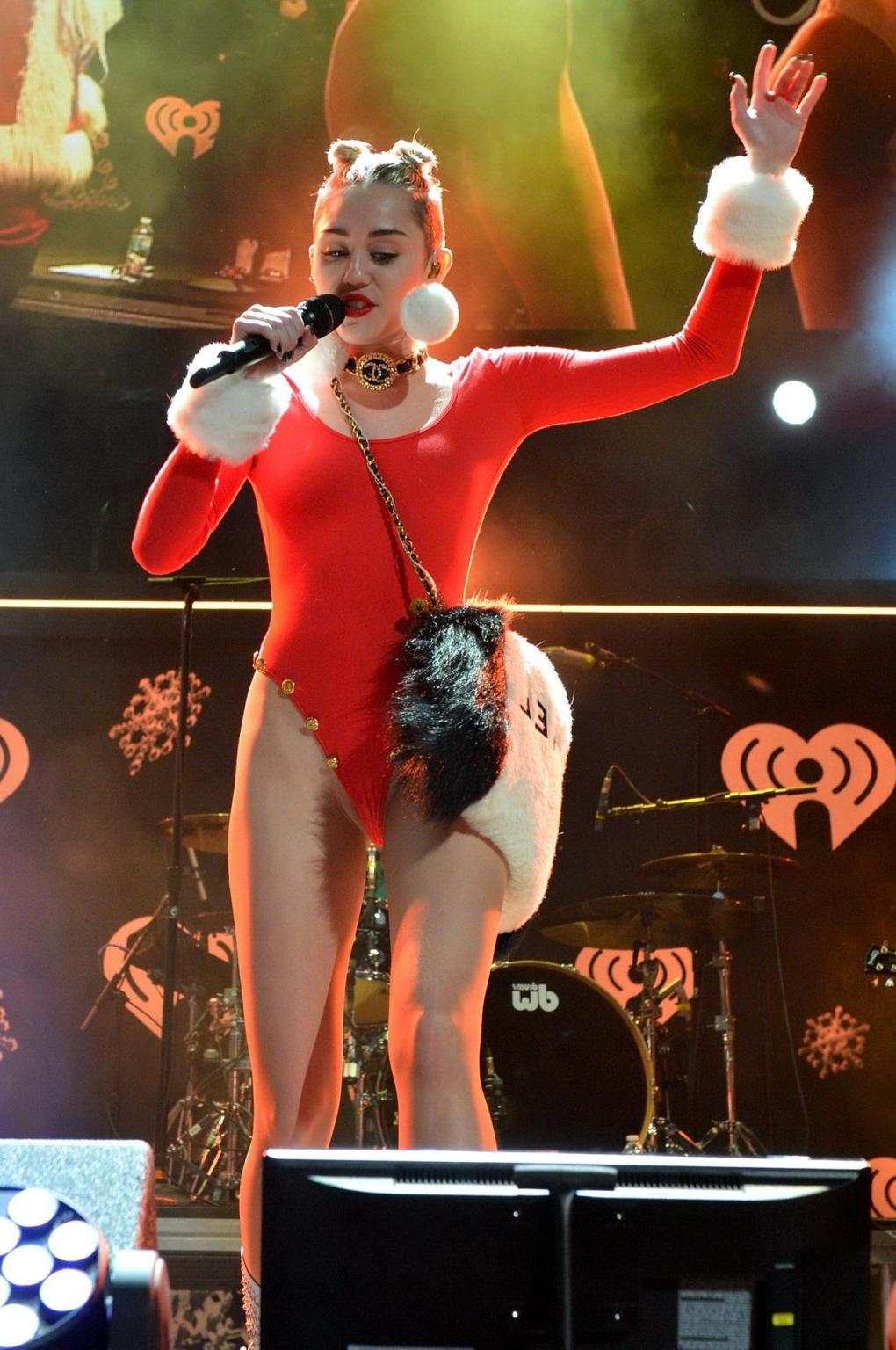 16P Miley Cyrus shows off pokies and ass wearing a red leotard on stage at 93.3 FLZ'