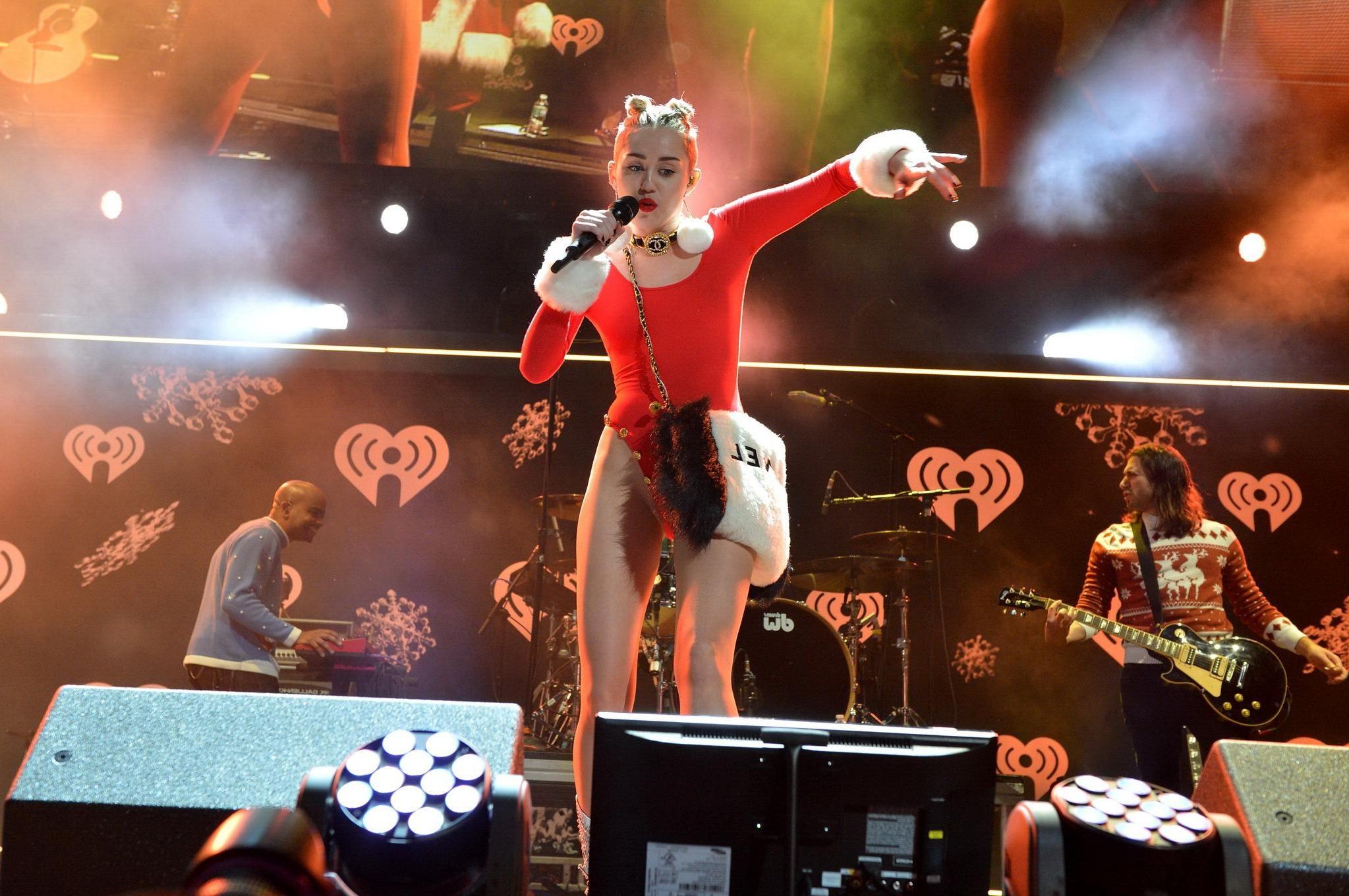 16P Miley Cyrus shows off pokies and ass wearing a red leotard on stage at 93.3 FLZ'