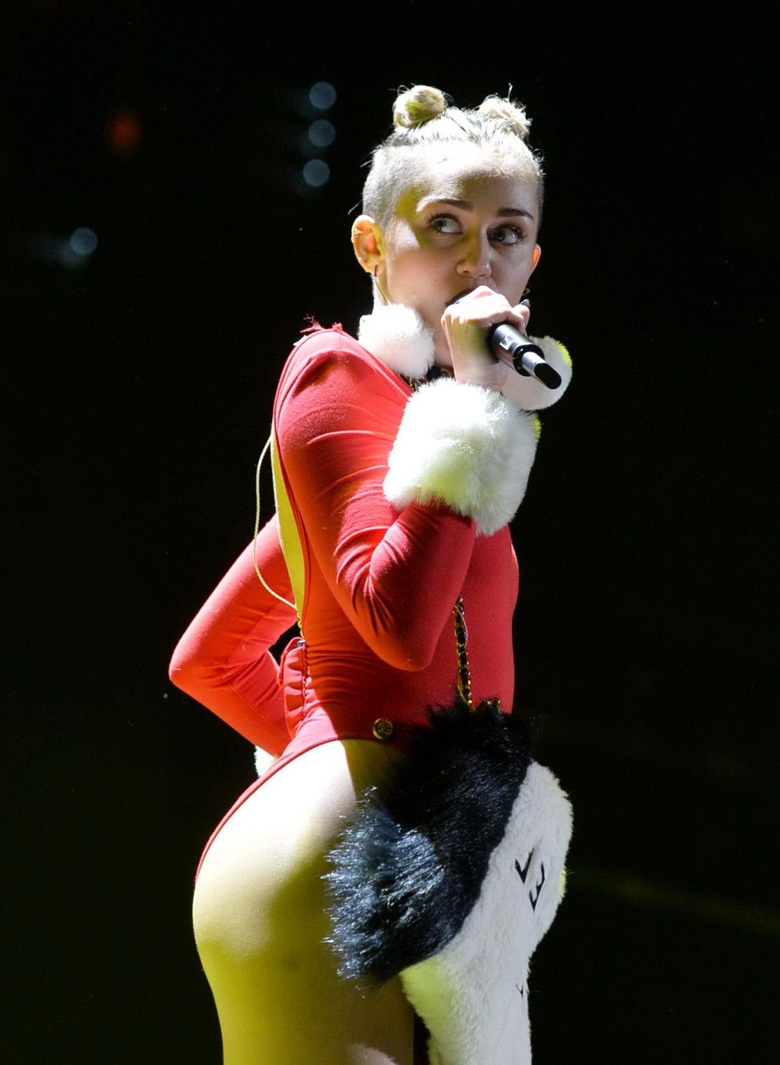 16P Miley Cyrus shows off pokies and ass wearing a red leotard on stage at 93.3 FLZ'