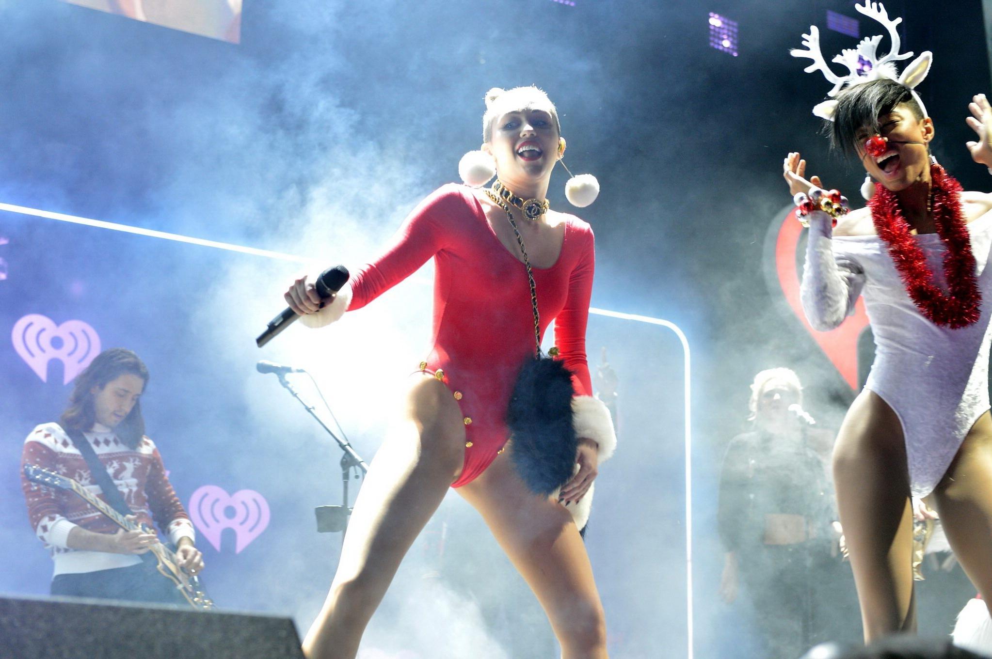 16P Miley Cyrus shows off pokies and ass wearing a red leotard on stage at 93.3 FLZ'