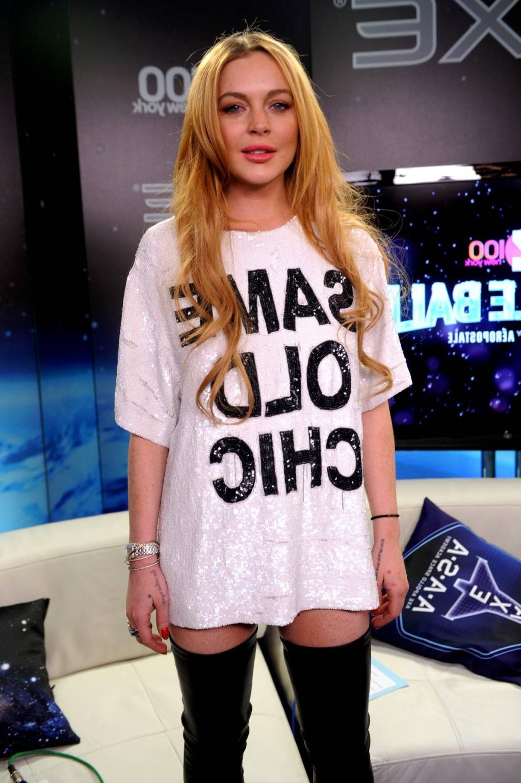 16P Lindsay Lohan wearing latex stockings at the Jingle Ball in New York City
