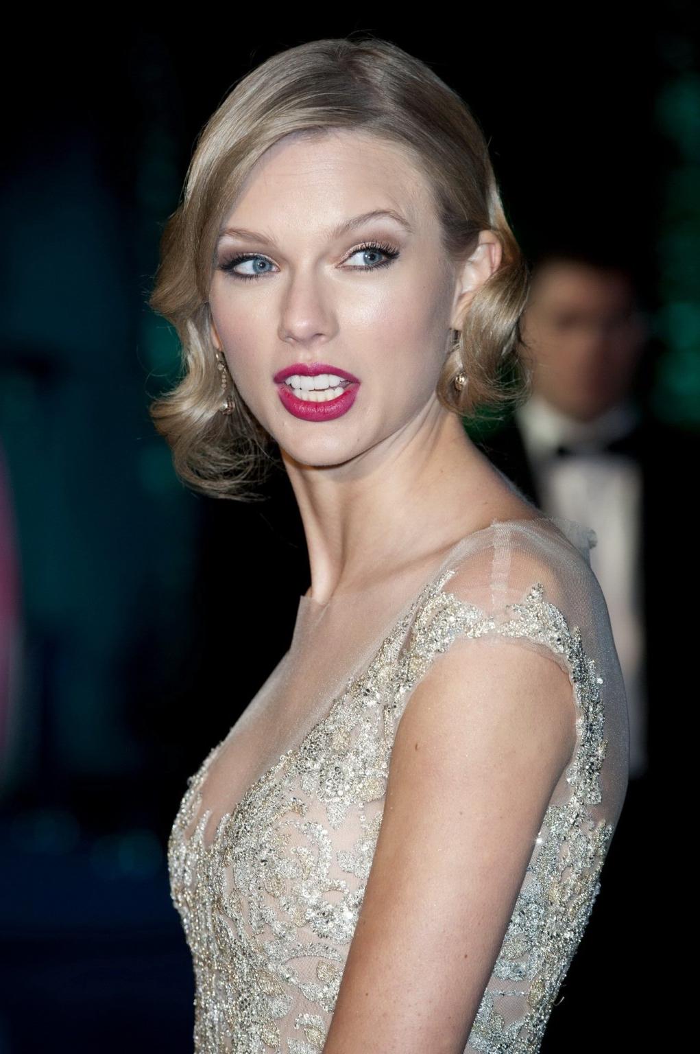 16P Taylor Swift braless wearing a tight partially see through dress at the Winter W