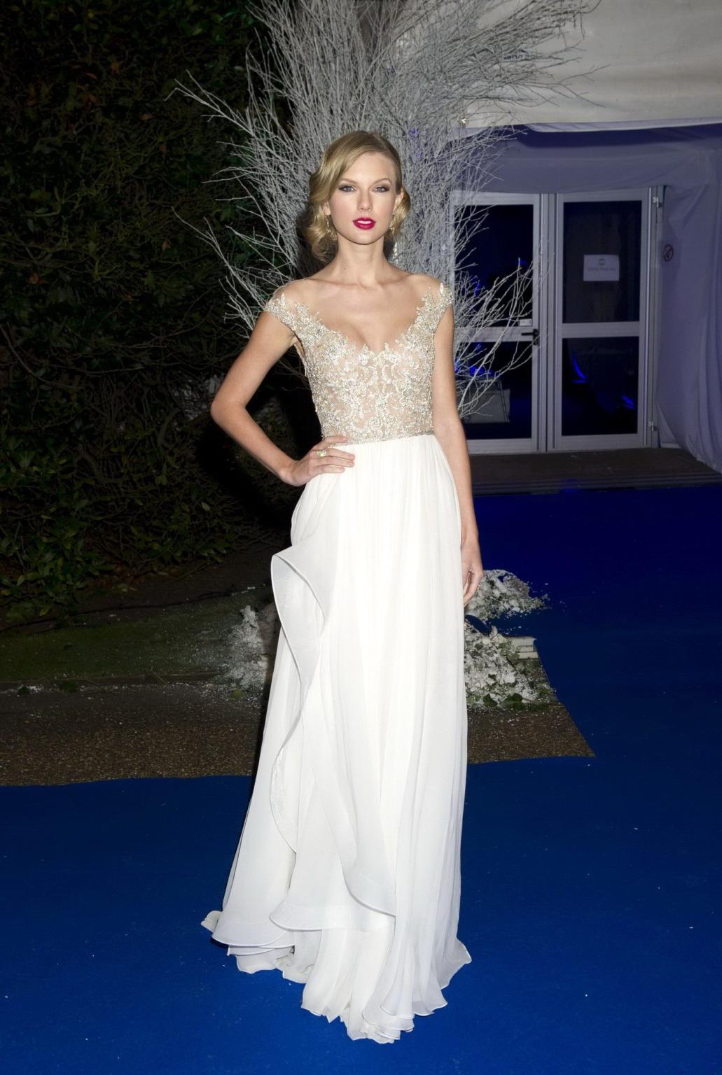 16P Taylor Swift braless wearing a tight partially see through dress at the Winter W
