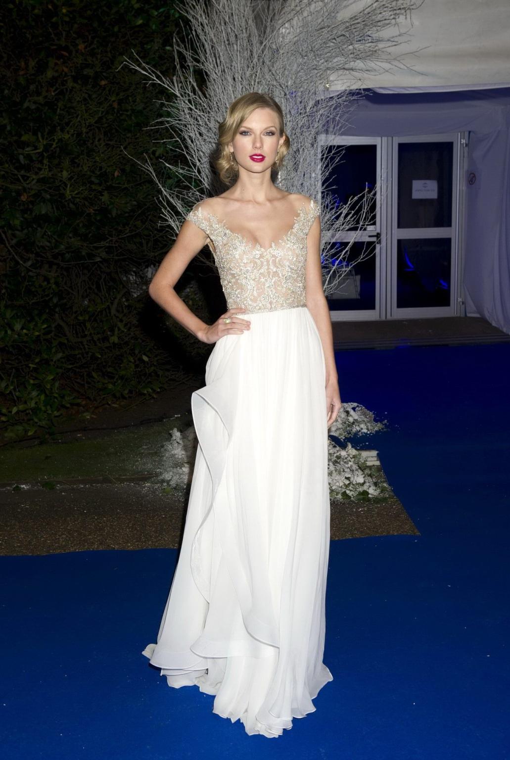 16P Taylor Swift braless wearing a tight partially see through dress at the Winter W