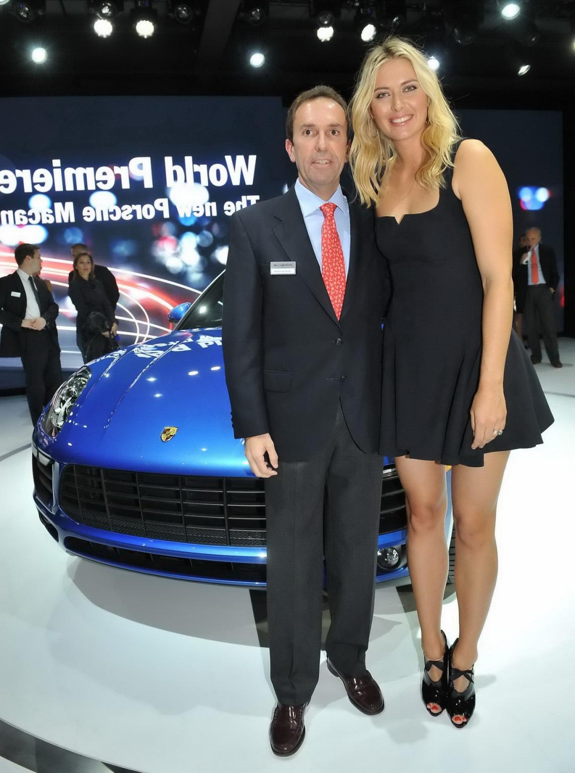 16P Maria Sharapova cleavy and leggy wearing black mini dress at Porsche Macan World