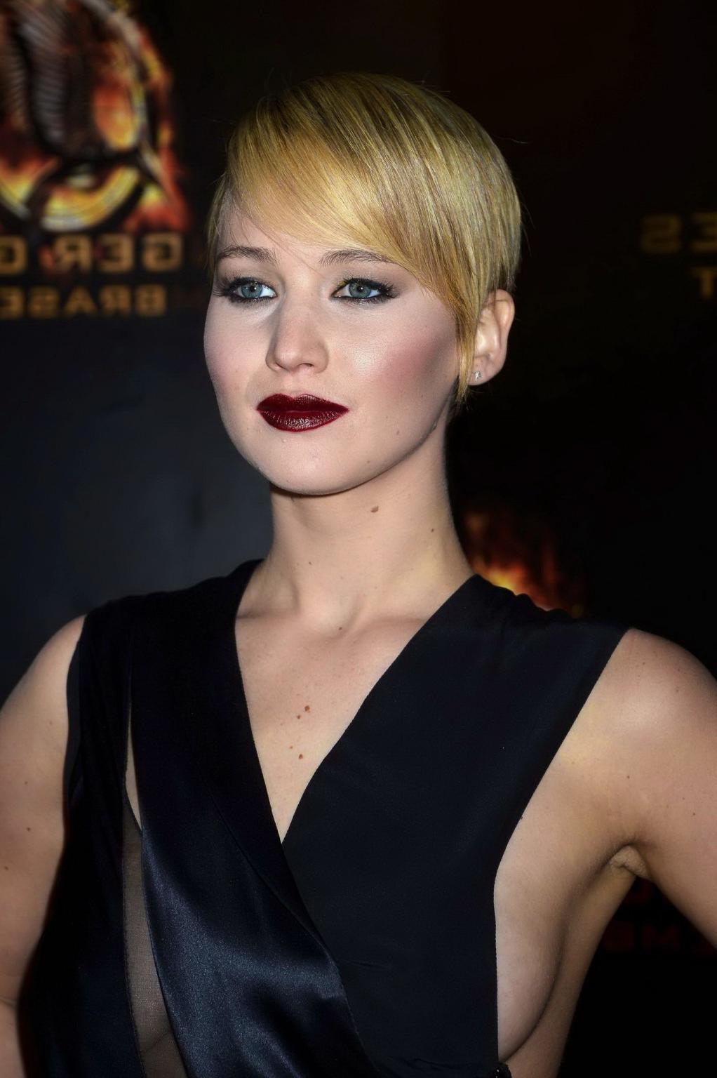 16P Jennifer Lawrence braless wearing skimpy black dress at The Hunger Games:Catchin