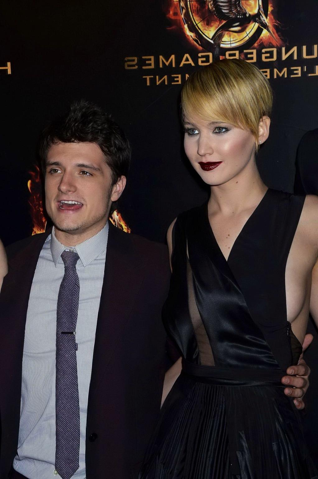 16P Jennifer Lawrence braless wearing skimpy black dress at The Hunger Games:Catchin