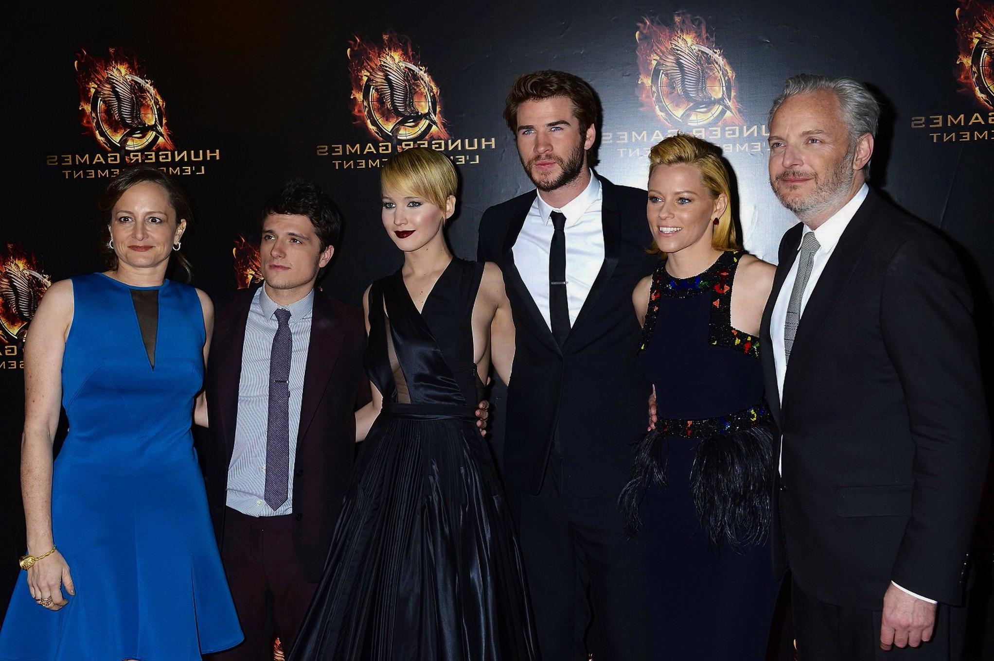 16P Jennifer Lawrence braless wearing skimpy black dress at The Hunger Games:Catchin