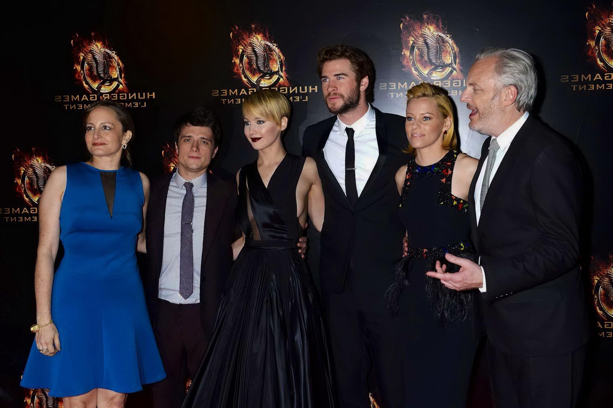 16P Jennifer Lawrence braless wearing skimpy black dress at The Hunger Games:Catchin