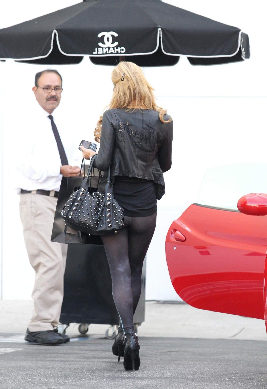 16P Paris Hilton shows off her ass wearing see through tights out for shopping in LA