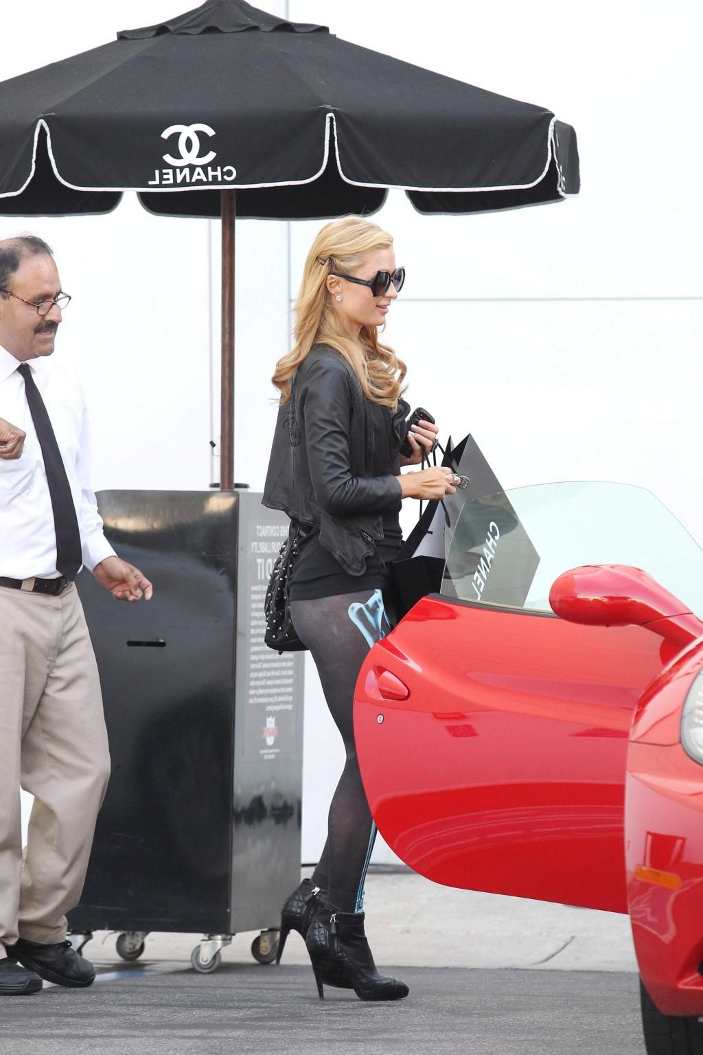 16P Paris Hilton shows off her ass wearing see through tights out for shopping in LA