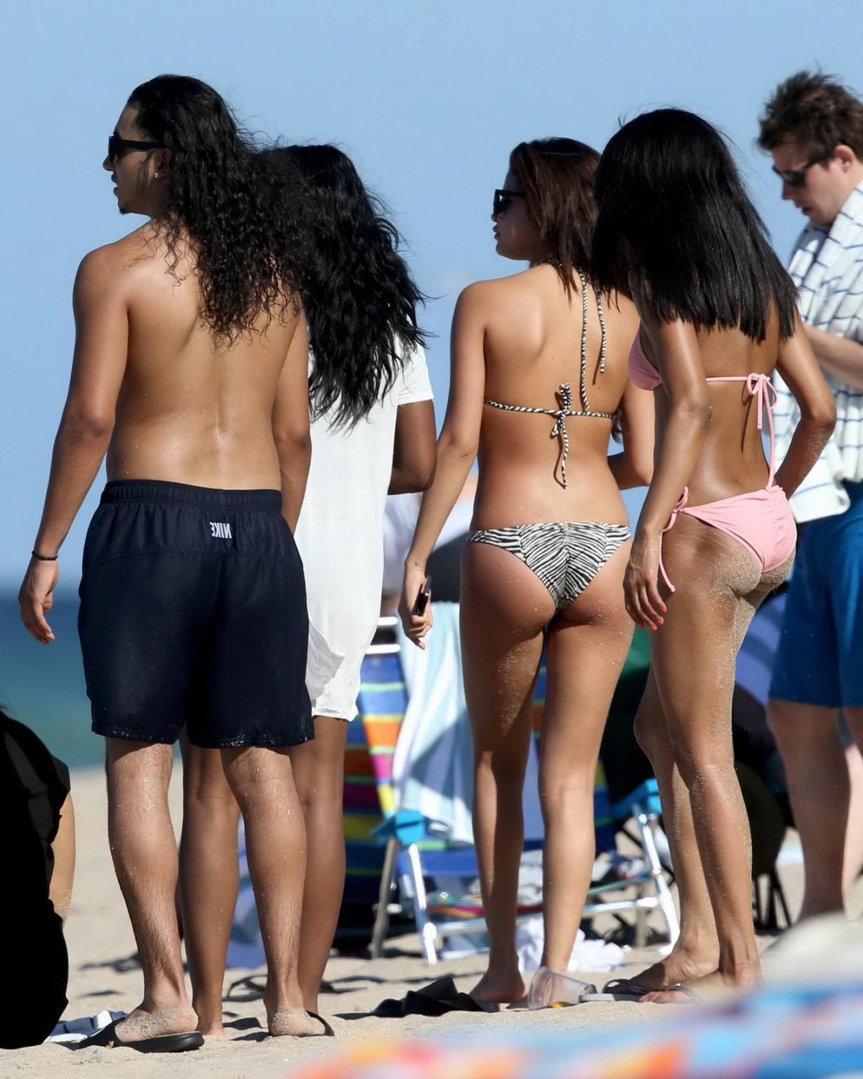 16P Selena Gomez wearing tiny zebra print bikini at the beach in Miami