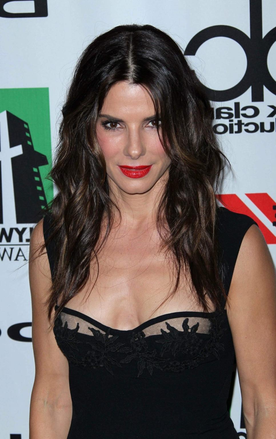 16P Sandra Bullock braless wearing a low cut black dress at the 17th annual Hollywoo