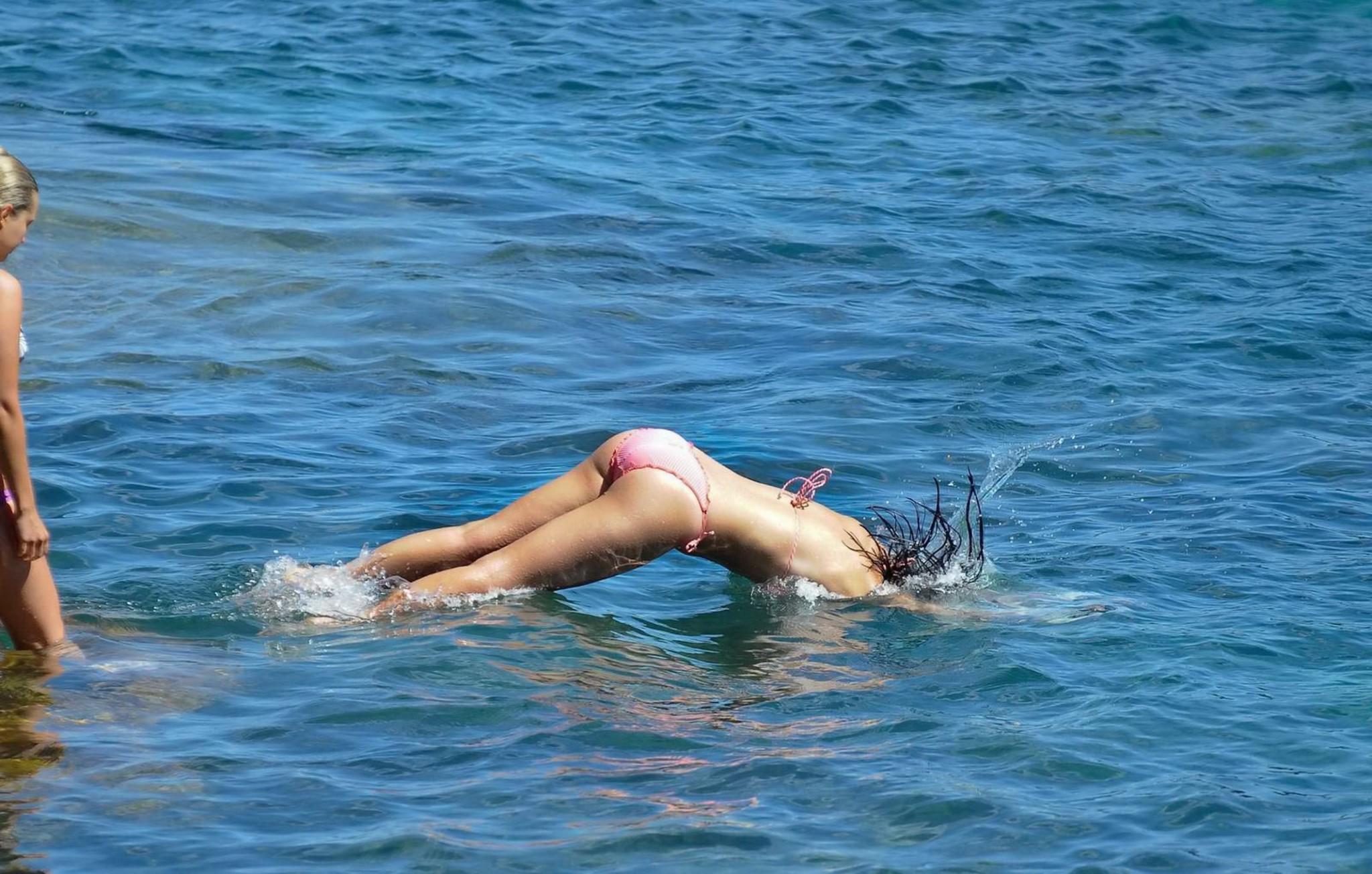 16P Demi Harman showing off her curvy body in a striped red bikini at the beach in S
