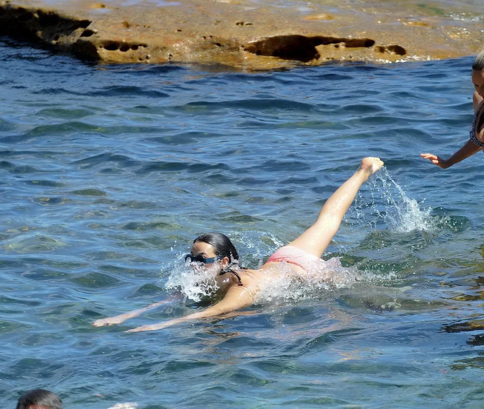 16P Demi Harman showing off her curvy body in a striped red bikini at the beach in S