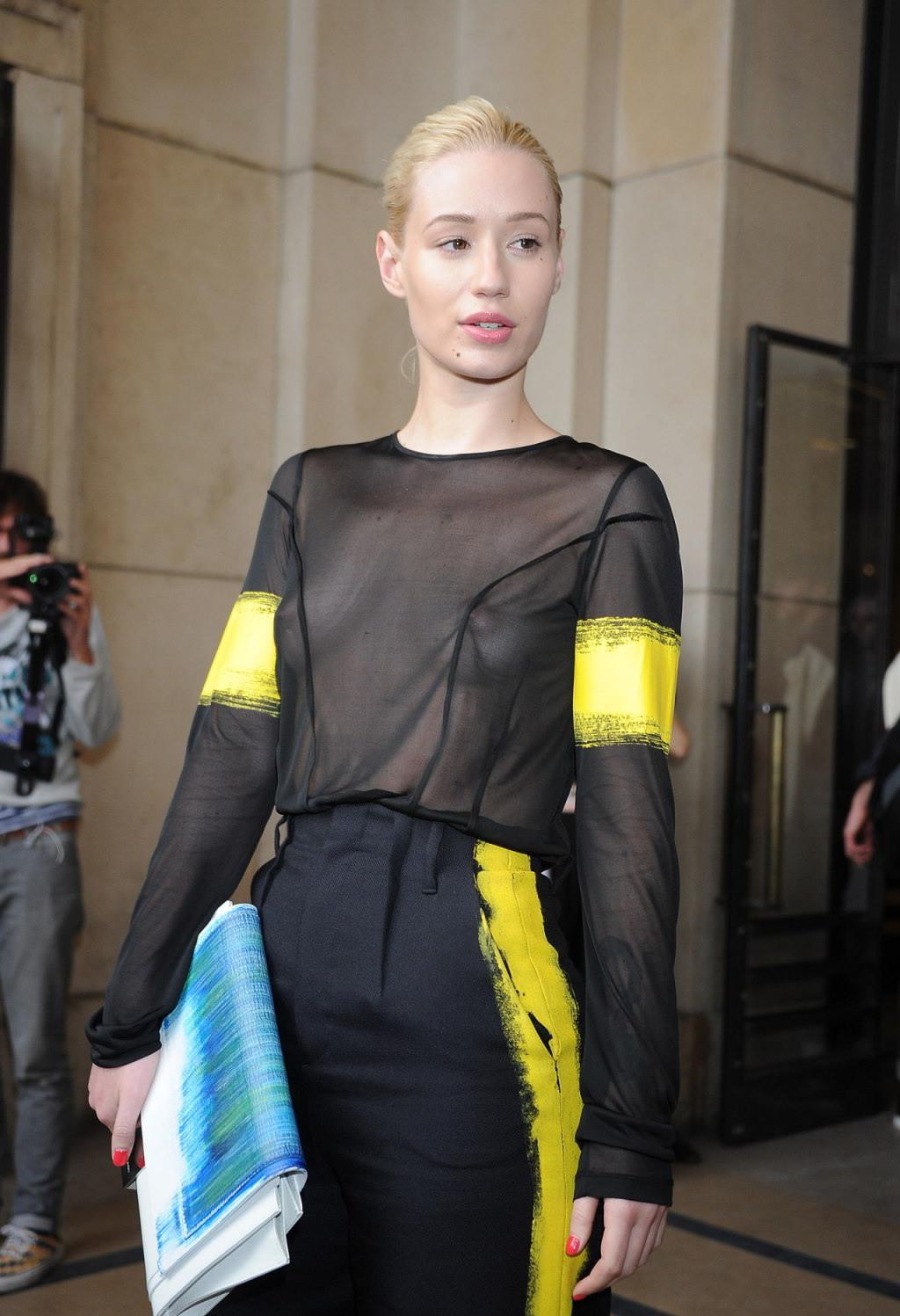 16P Iggy Azalea shows off her tits wearing a see through top at the Maison Martin Ma